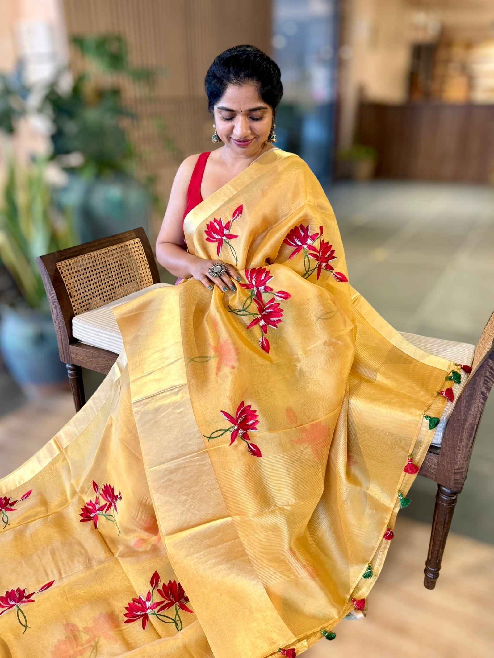 Mustard Organza Saree with Lotus flower embroidery and Satin Borders.
