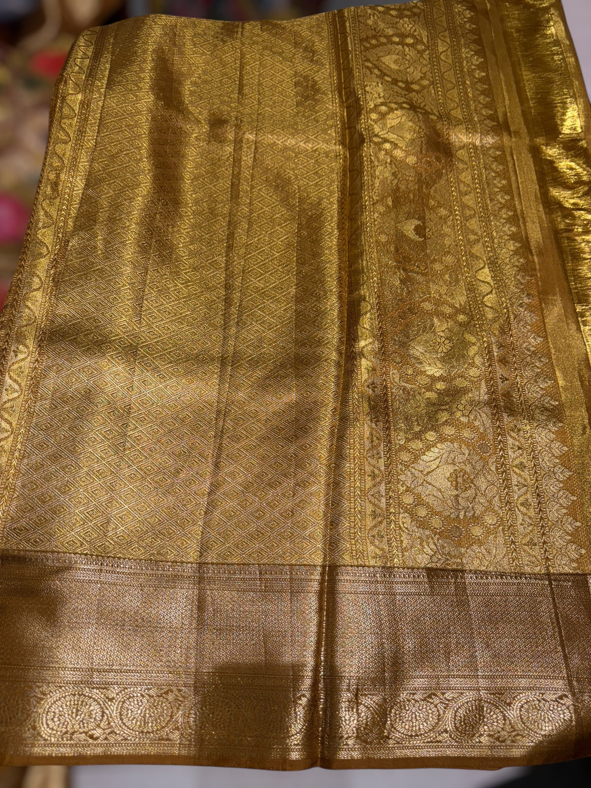 Molten Gold Kanjeevaram Tissue Saree with allover embroidery