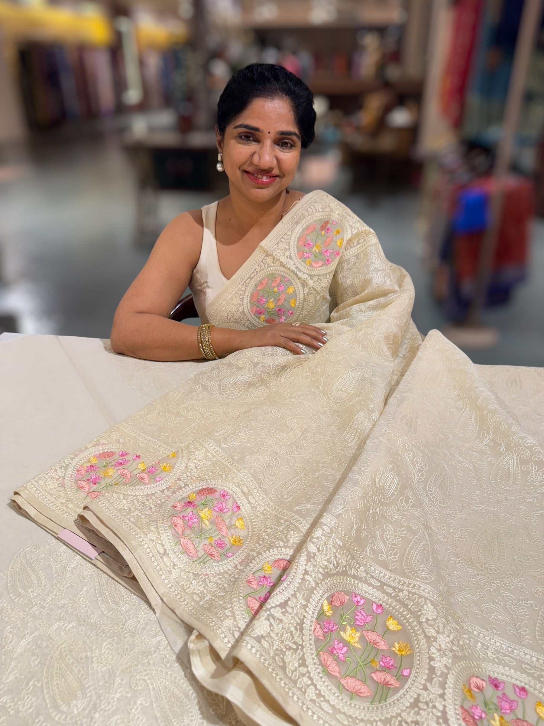 Ivory Organza Saree with allover Chikankari Embroidery and pichwai border