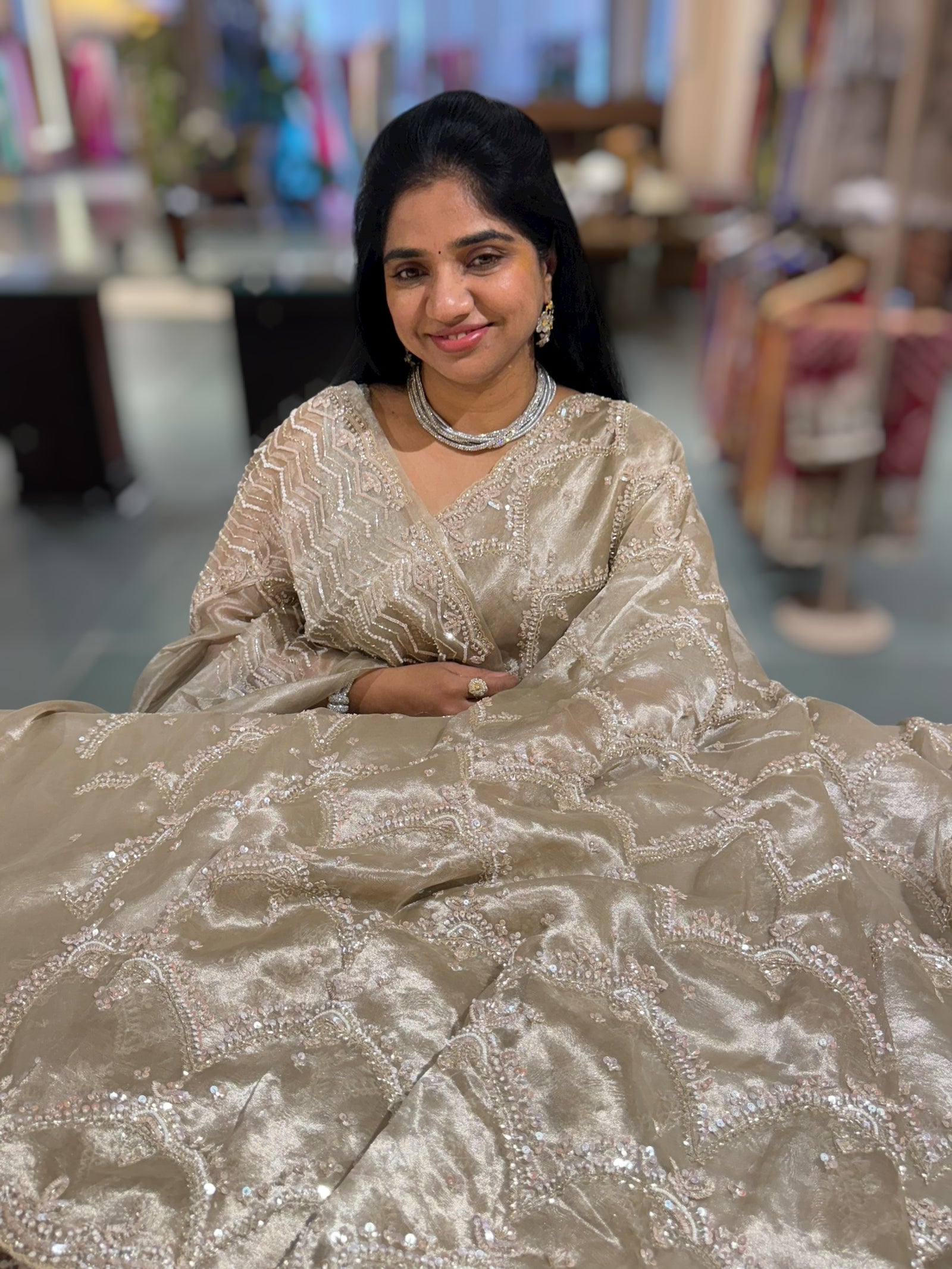 Nude tissue saree with heavy allover intricate handwork