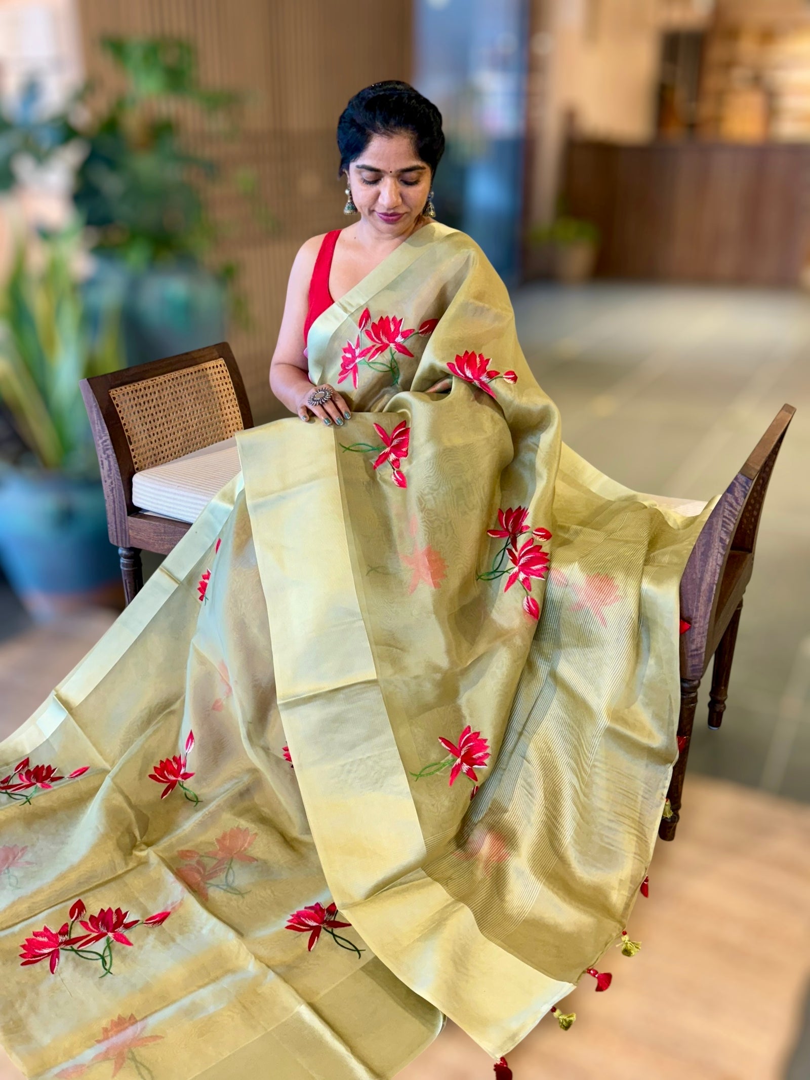 Olive Green Organza Saree with Lotus flower embroidery and Satin Borders.