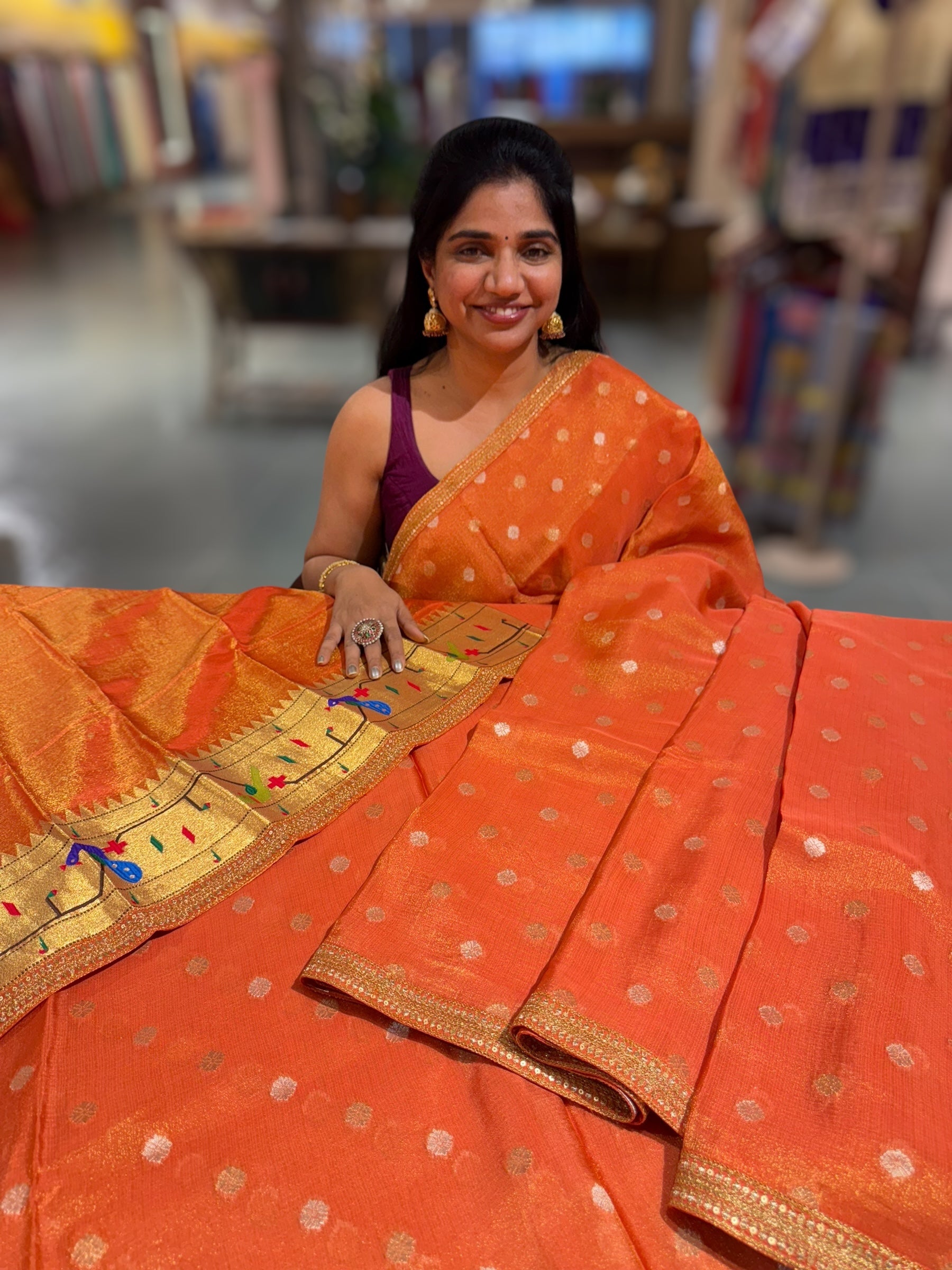 Orange tissue Kota saree with sabyasachi borders and fancy Pythani tissue blosue