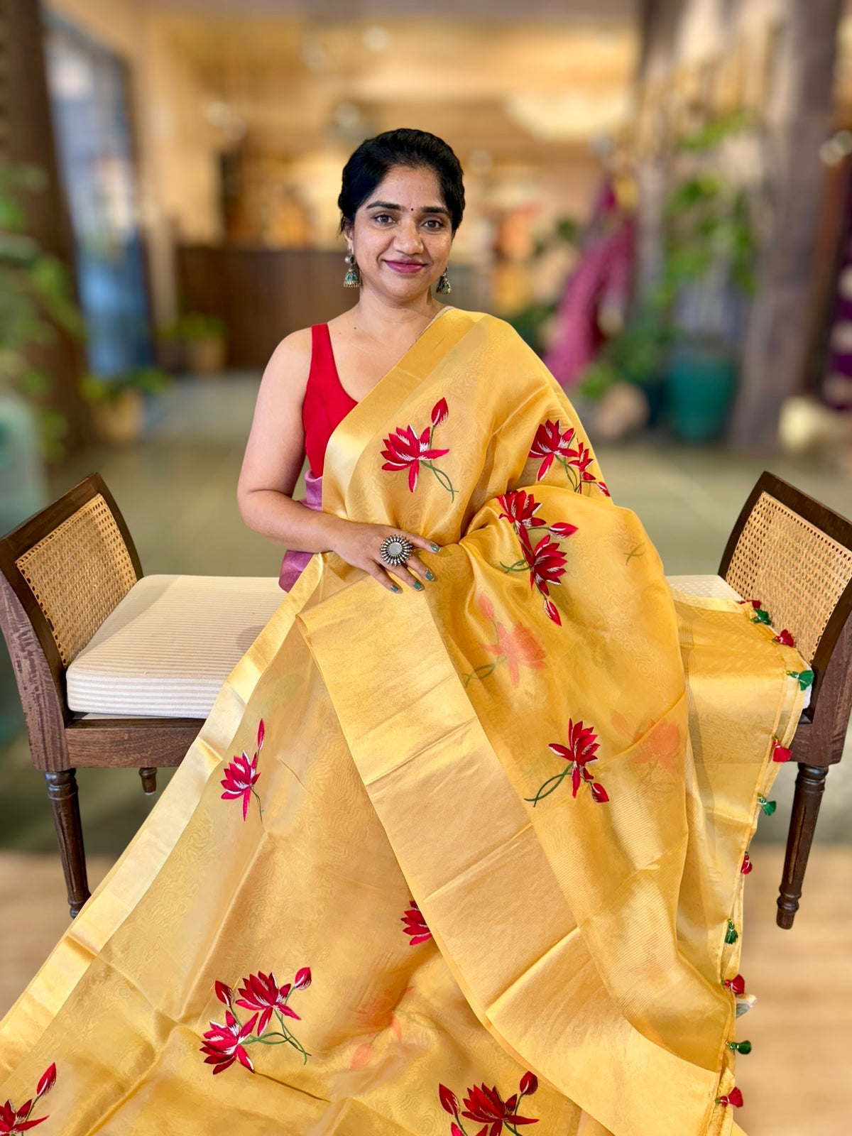 Mustard Organza Saree with Lotus flower embroidery and Satin Borders.