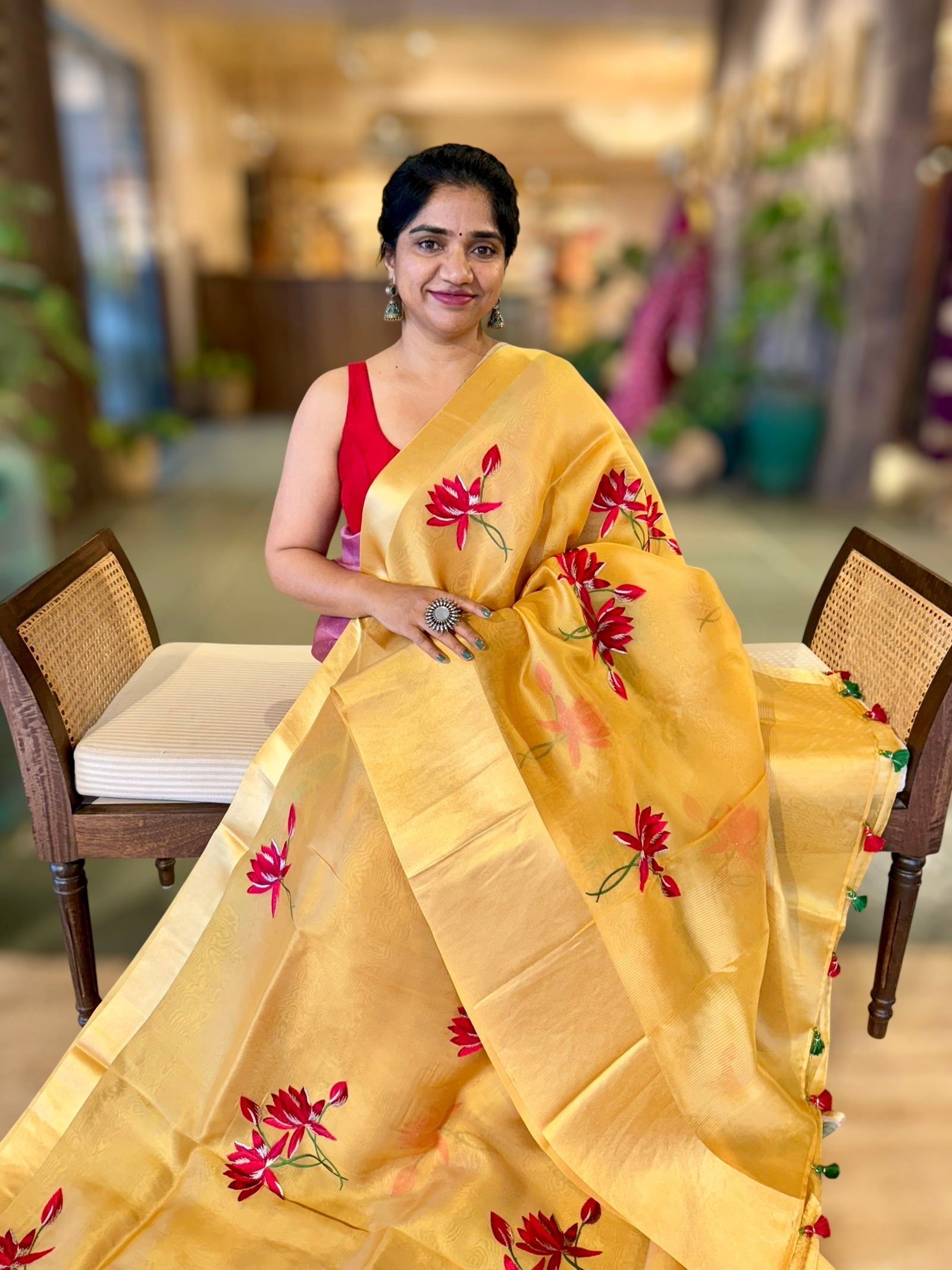 Mustard Organza Saree with Lotus flower embroidery and Satin Borders.