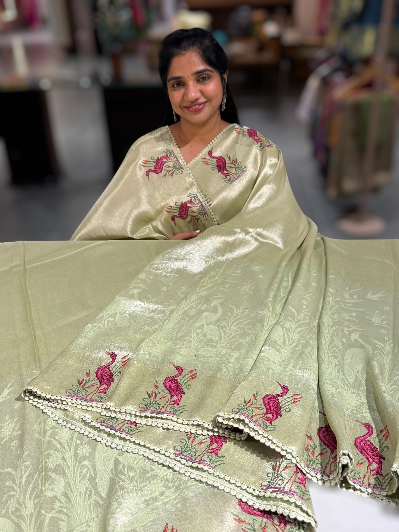 Mint Green Banarasi Brocade tissue saree with tonchui style weaving & petite point embroidered swan border