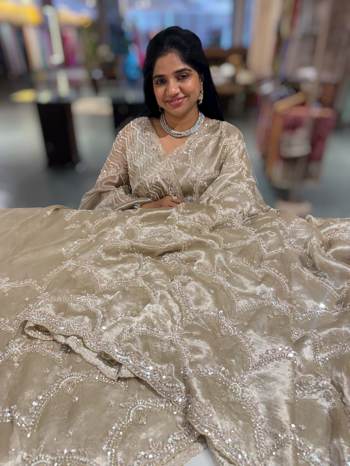 Nude tissue saree with heavy allover intricate handwork