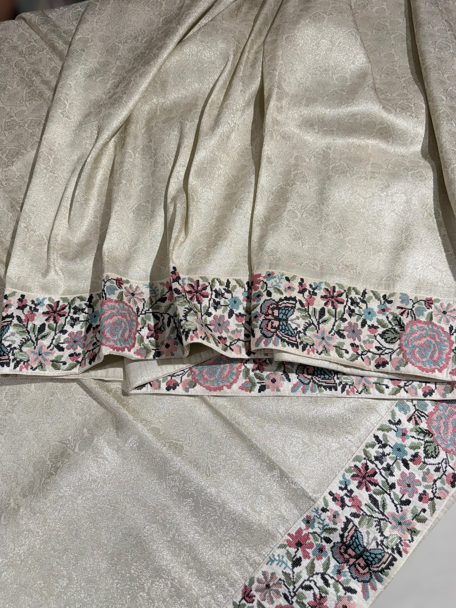 Half White Banarasi brocade Silk Saree with Petite Point Embroidered Border.