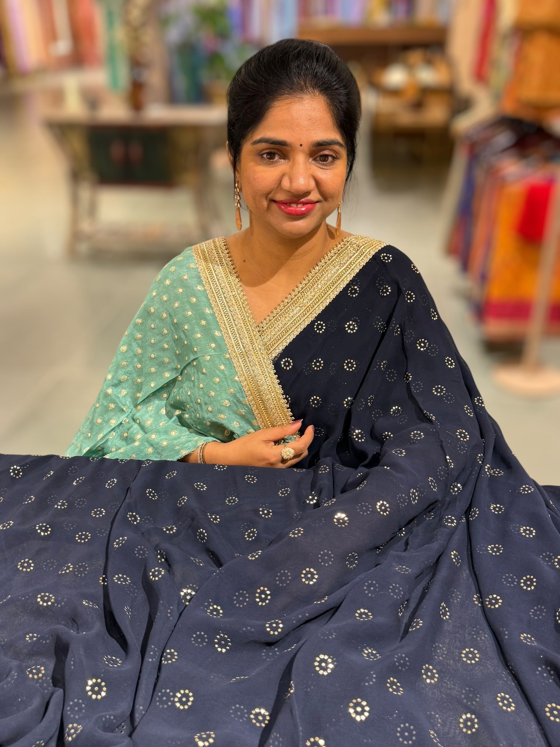 Midnight blue Georgette Saree with stick on Badla in flower pattern