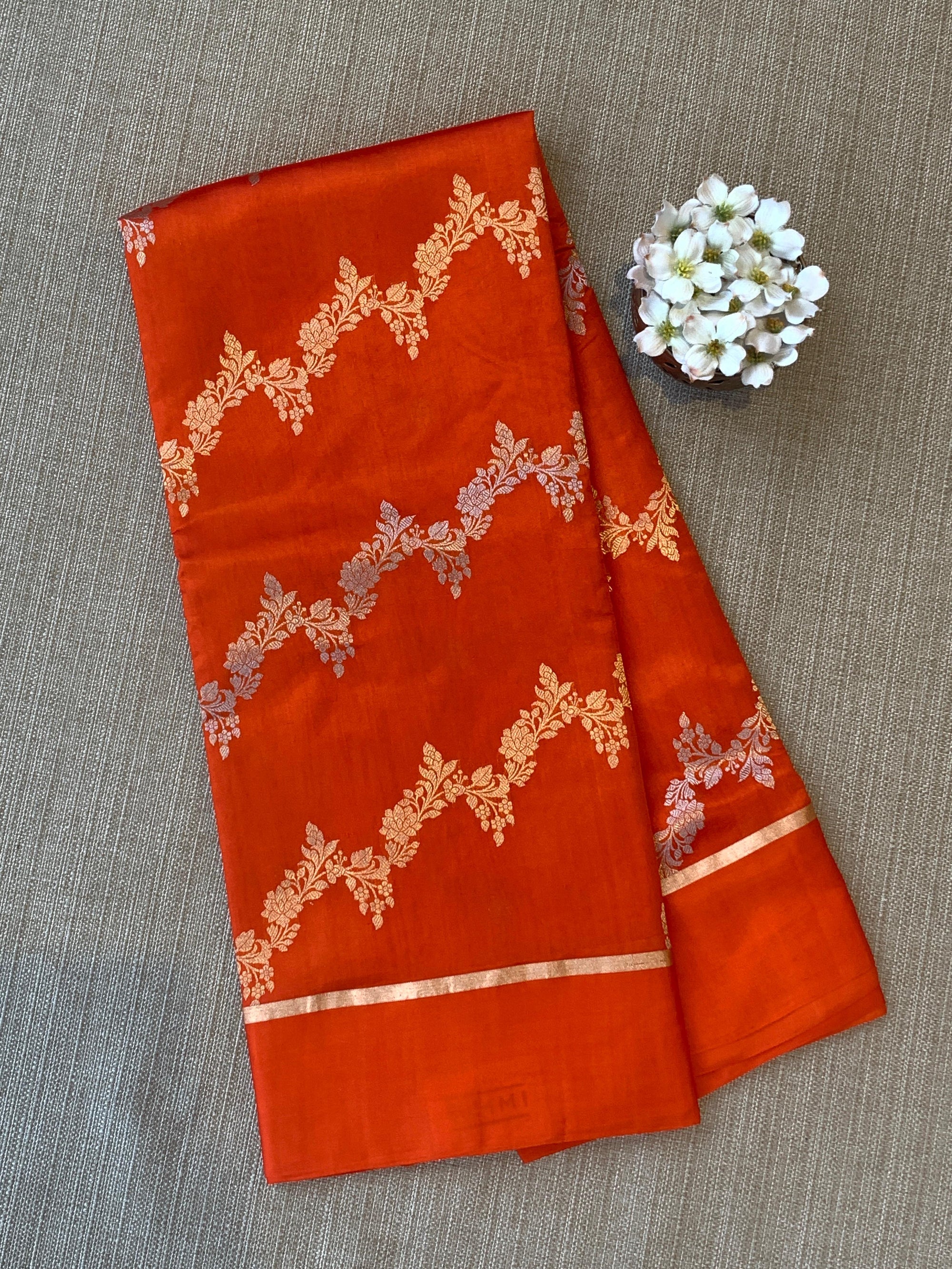 Orange Raw Mangoe Silk Saree in half and half style