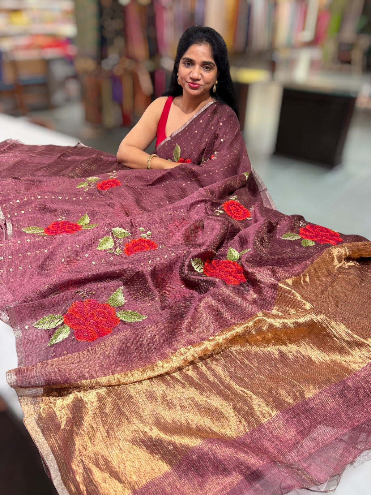 Winish brown Tussar Kota Saree with embedded sequnce and hibuscus flower embroidery