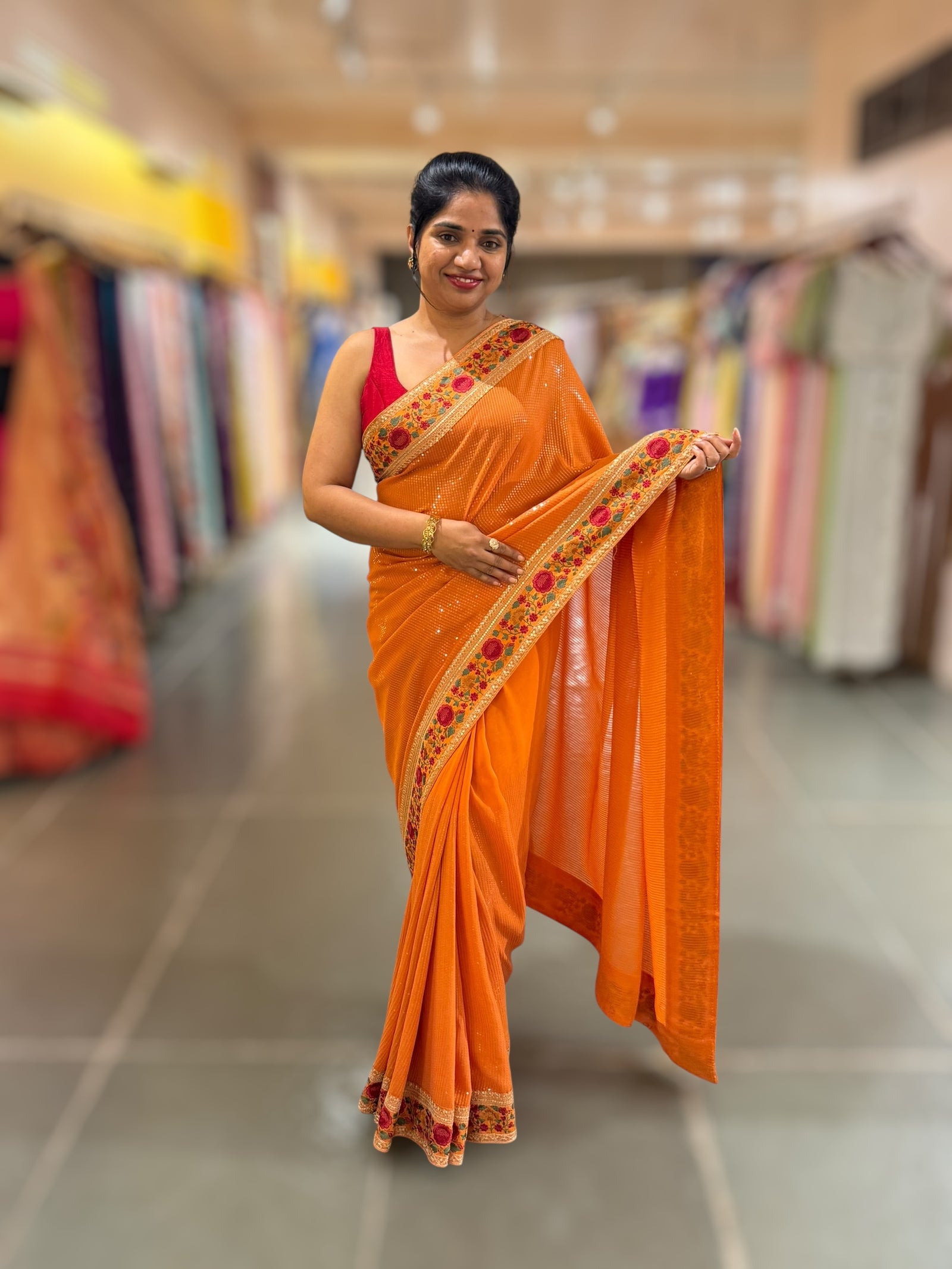 Orange Georgette sequnce Saree with Sabyasachi borders