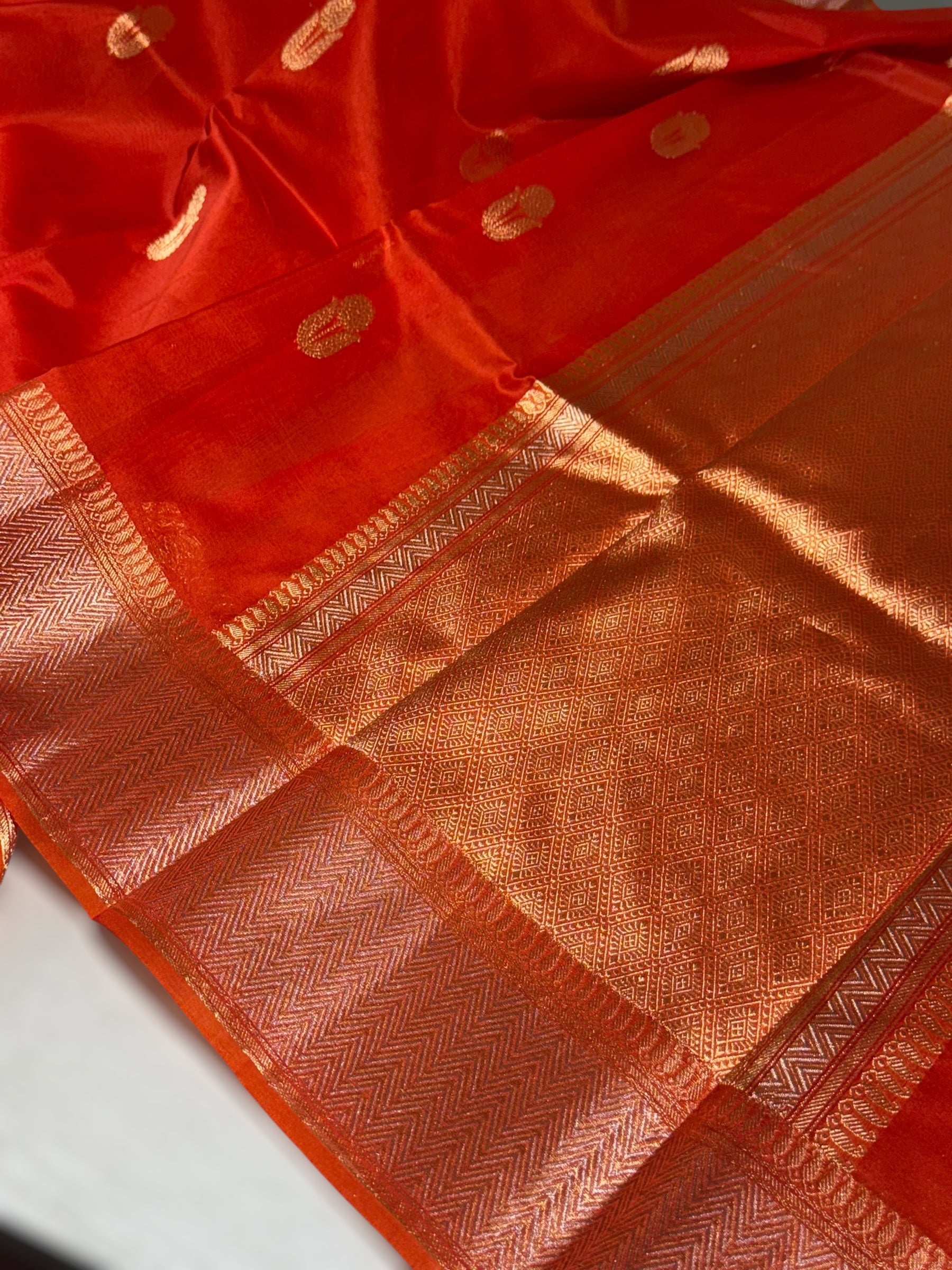 Dark Orange Premium Kora Banarasi Saree with heavy weaving borders and Raw mango style motifs