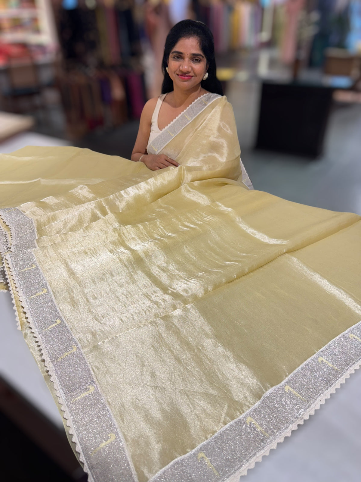 Pastel yellow Tissue Saree with pythani tissue embroidered border