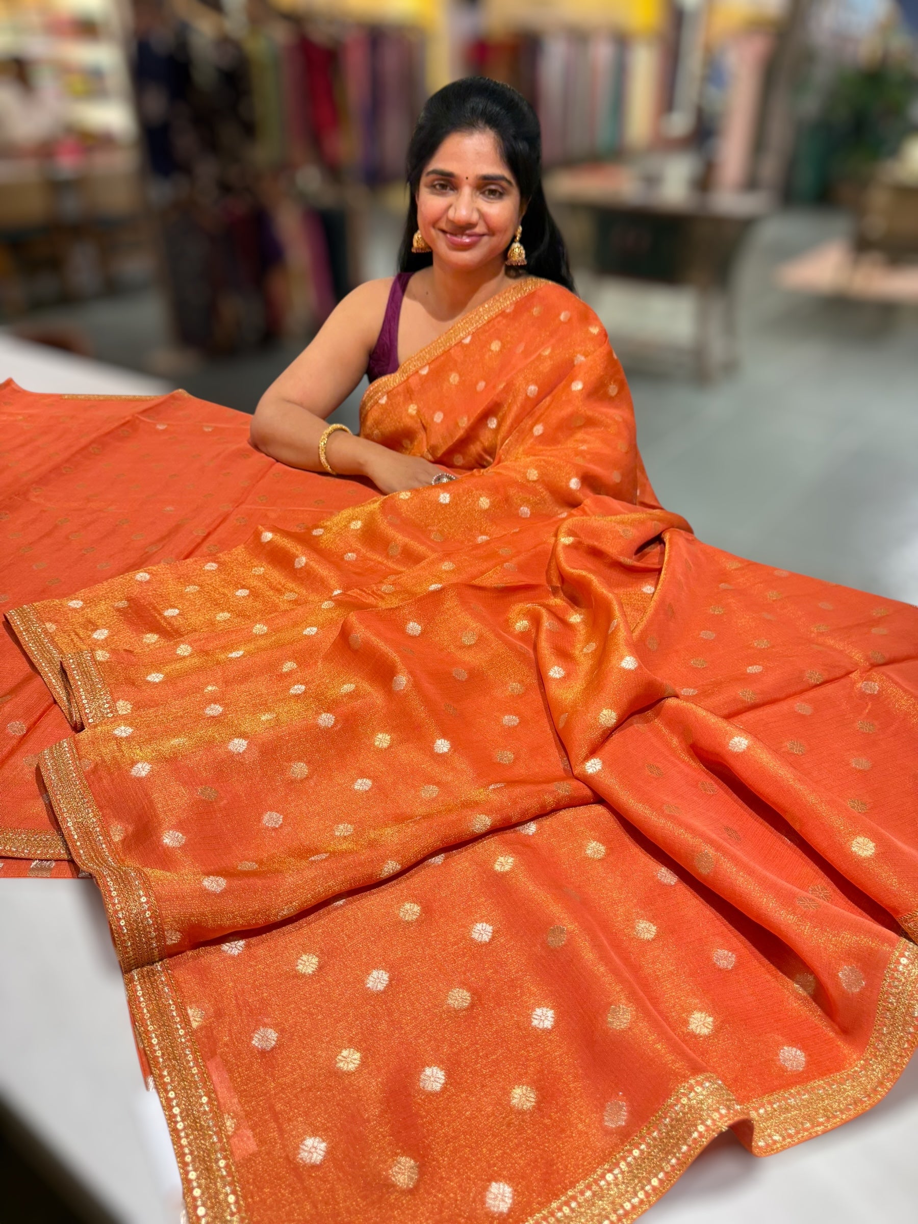 Orange tissue Kota saree with sabyasachi borders and fancy Pythani tissue blosue