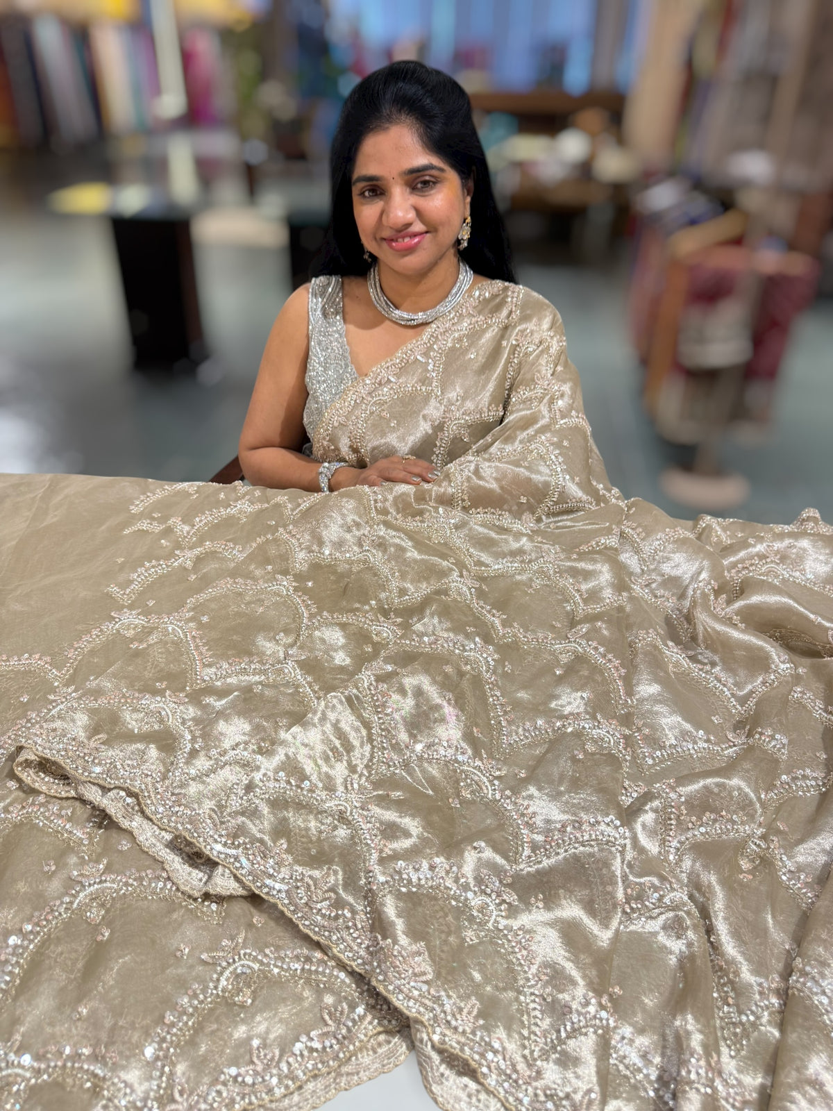 Nude tissue saree with heavy allover intricate handwork