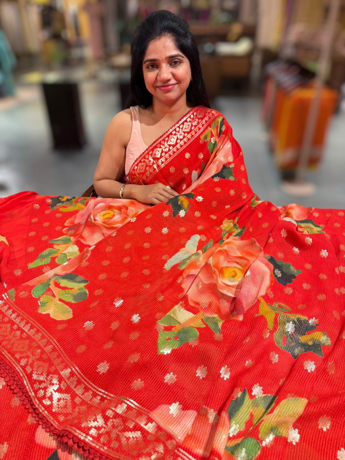 Red georgette sequence saree with statement floral print