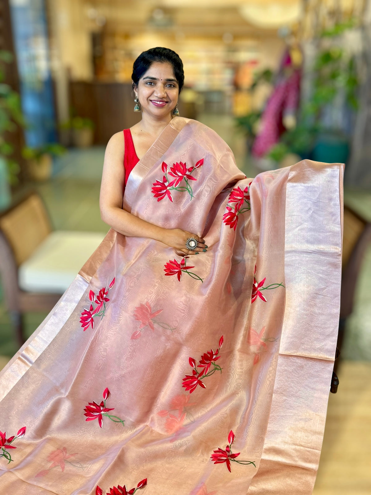 Onion Pink Organza Saree with Lotus flower embroidery and Satin Borders.