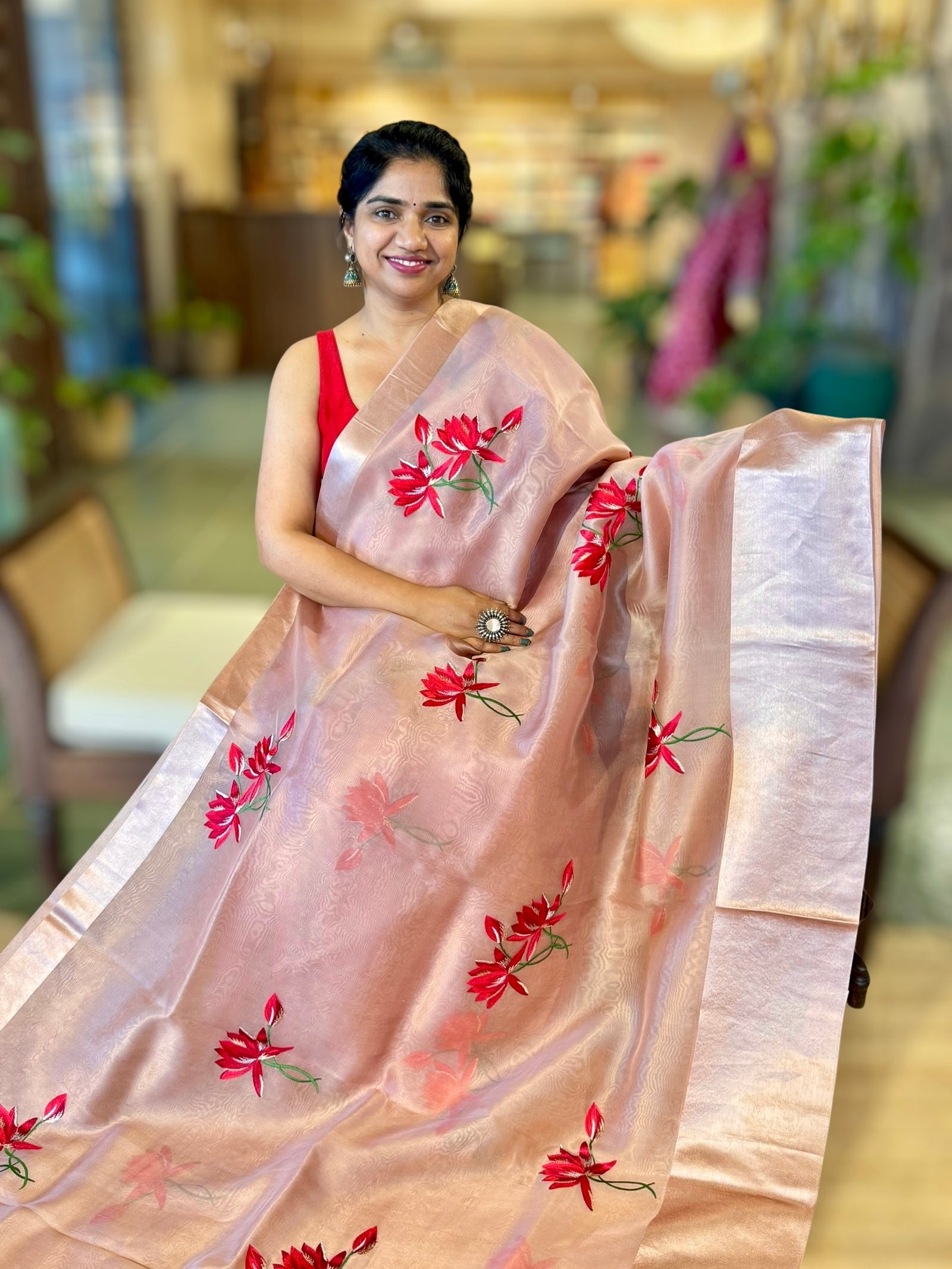 Onion Pink Organza Saree with Lotus flower embroidery and Satin Borders.