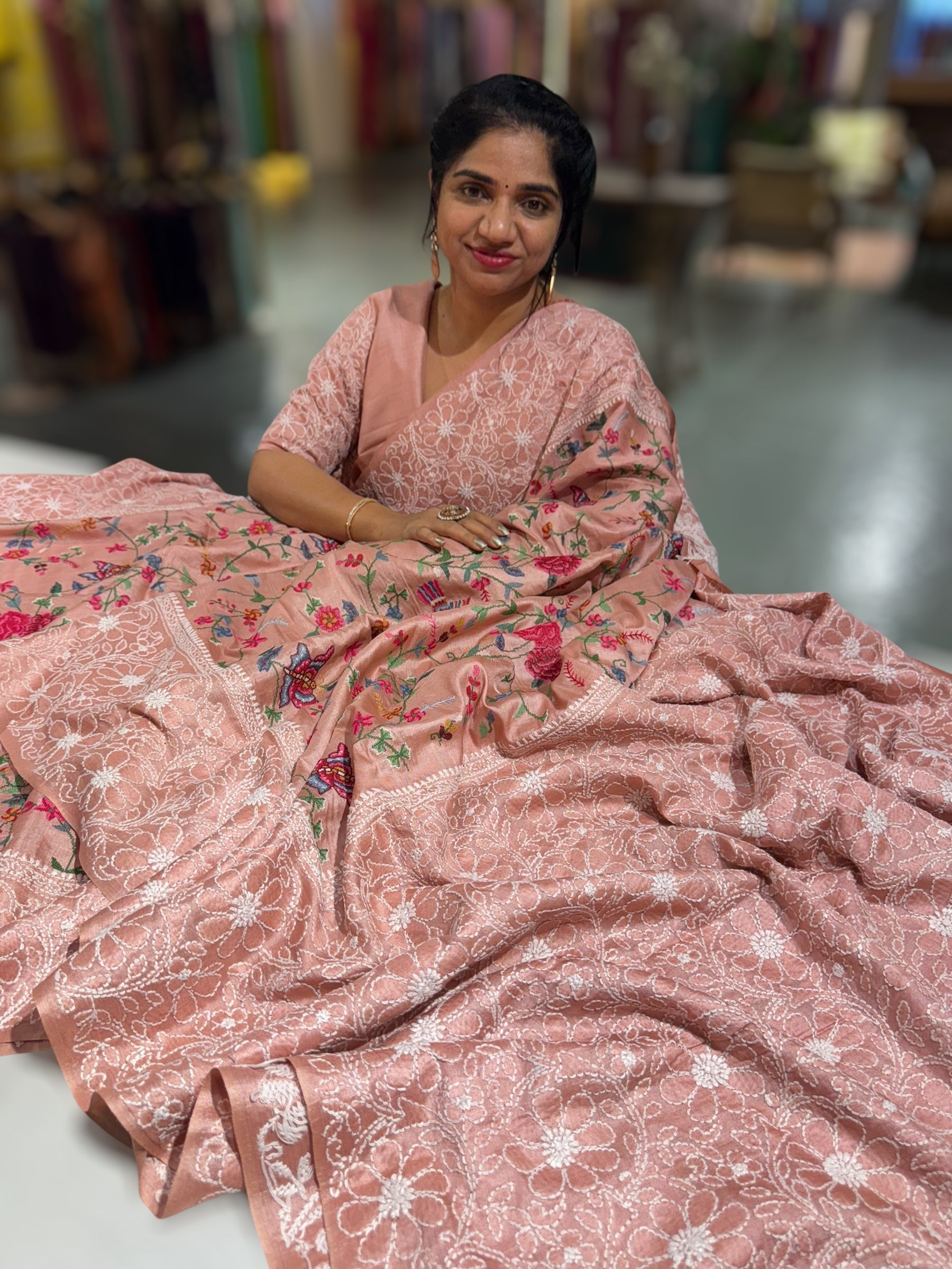 Peach Pink Tussar Saree with lucknowi border and pallu with allover petite point embroidery.