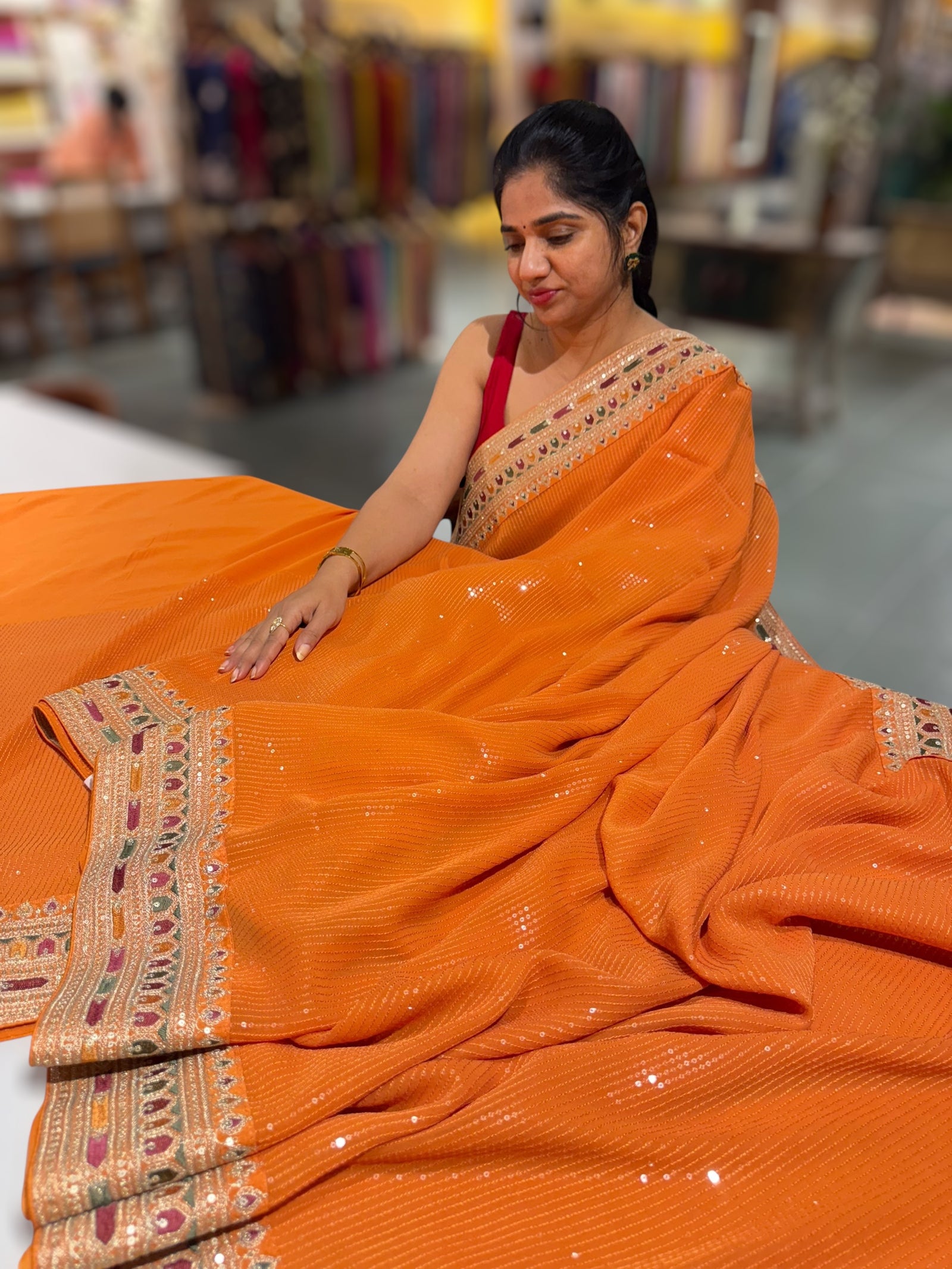 Orange Georgette sequnce Saree with Sabyasachi borders