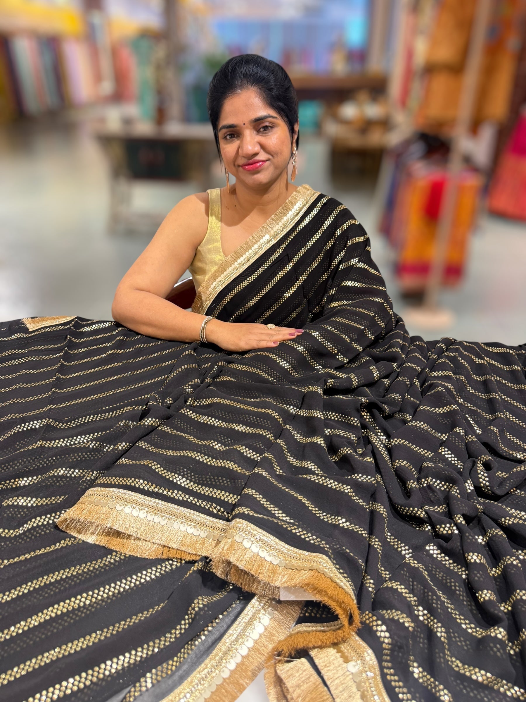 Black Georgette Saree with stick on Badla in stripes pattern and kiran Lace