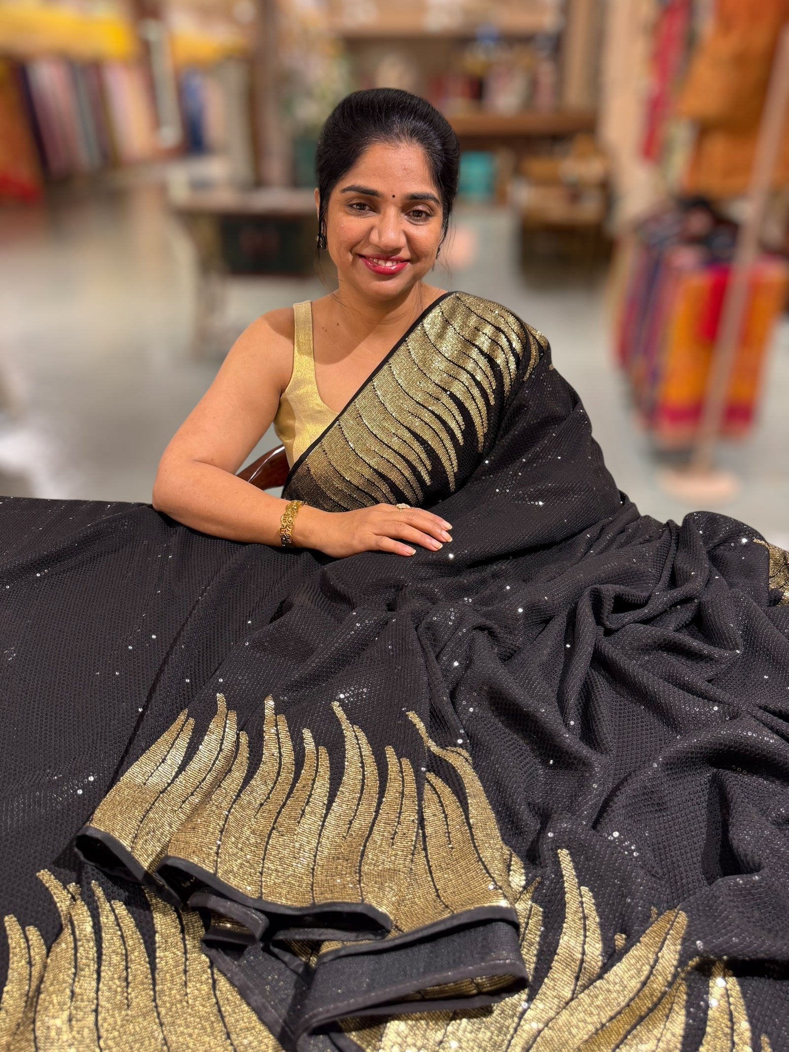 Black Georgette Saree with stunning Gold embroidered Border