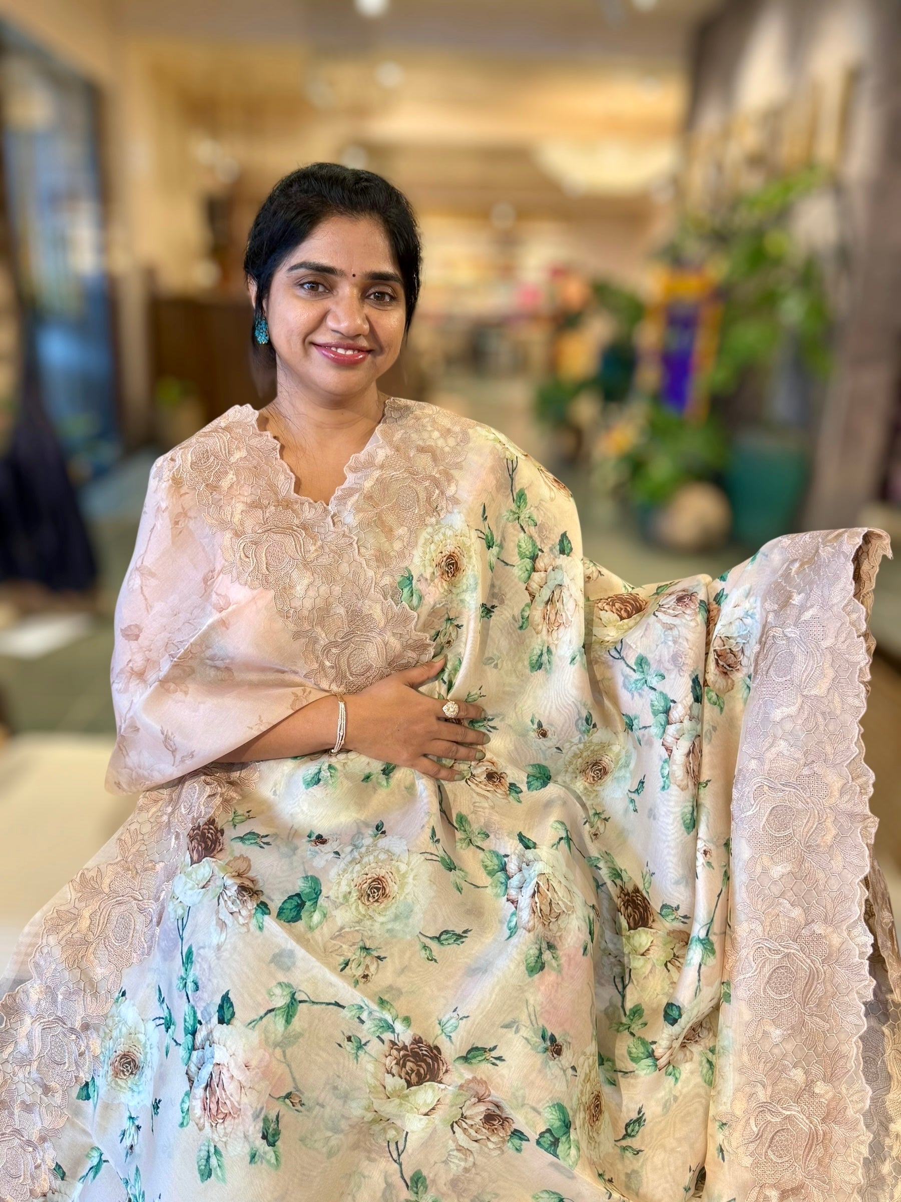 Nude Printed Organza Saree With Chantilly Lace Style Embroidered Border.