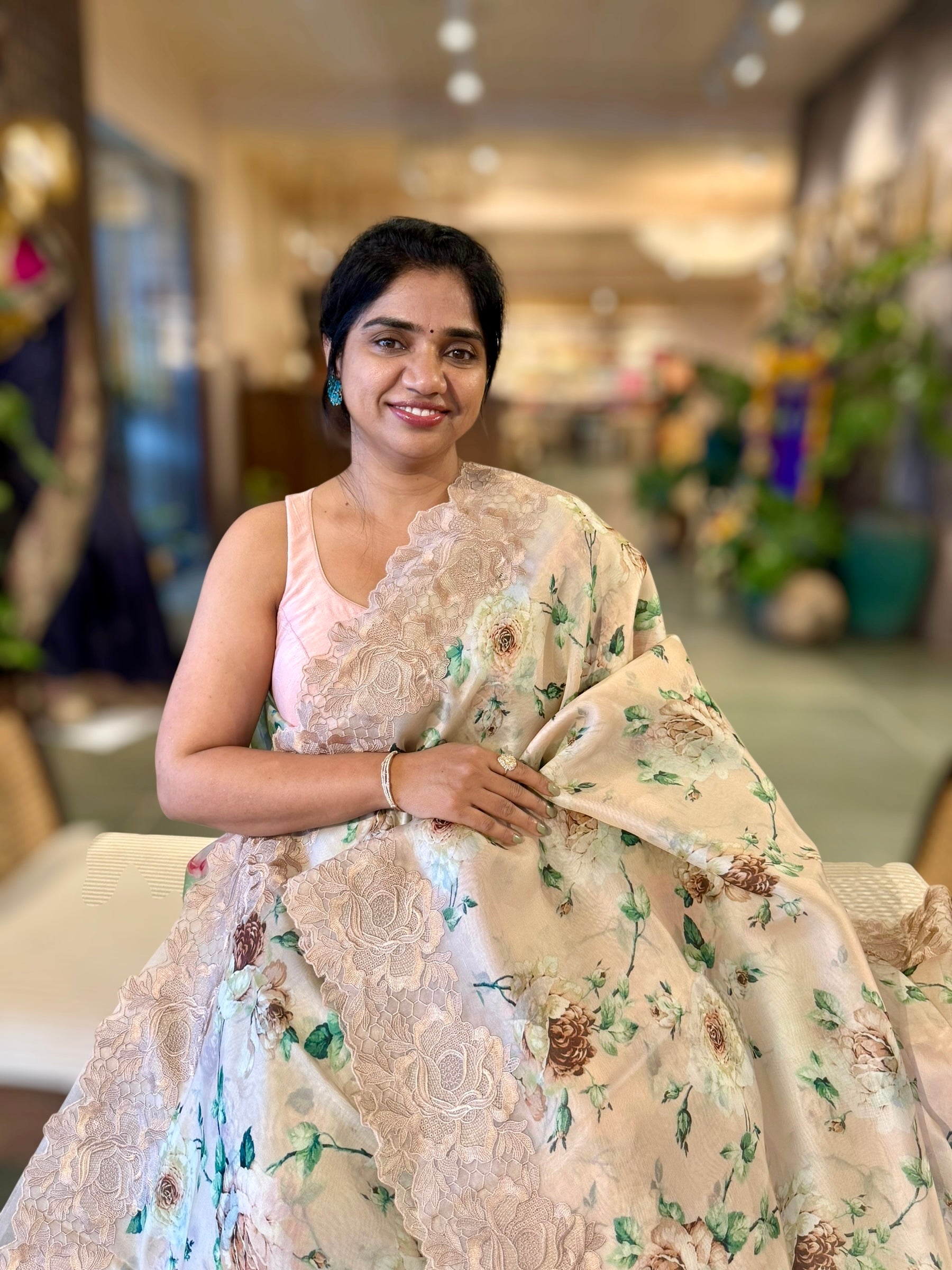 Nude Printed Organza Saree With Chantilly Lace Style Embroidered Border.