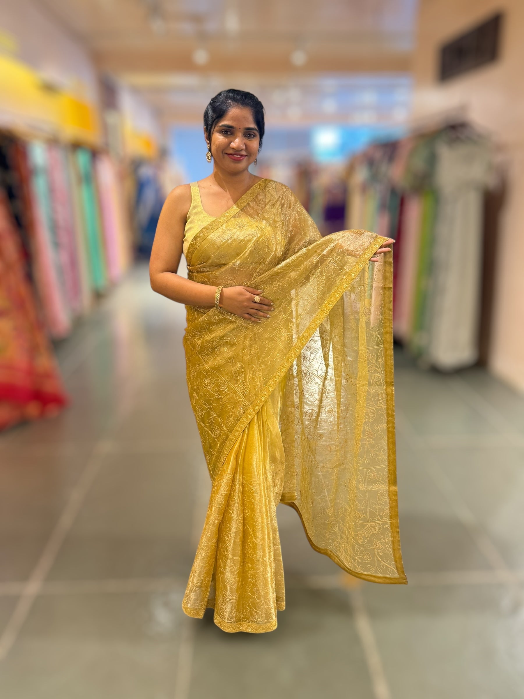 Yellow gold Tissue saree with Allover zari embroidery hemlined with sabyasachi borders & paired with pen kalamkari blouse