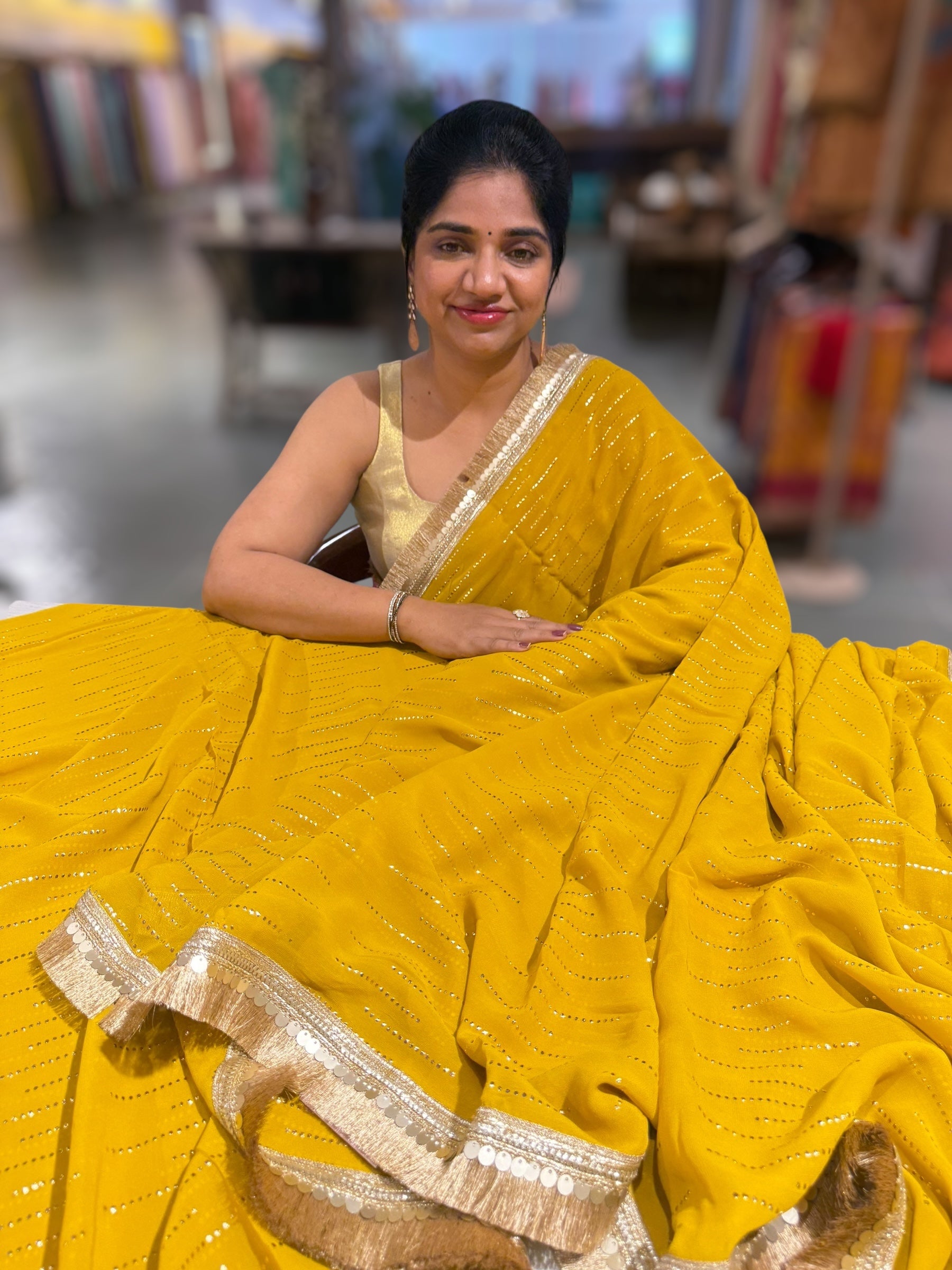 Yellow light Georgette Saree with stick on Badla in stripes pattern and kiran Lace