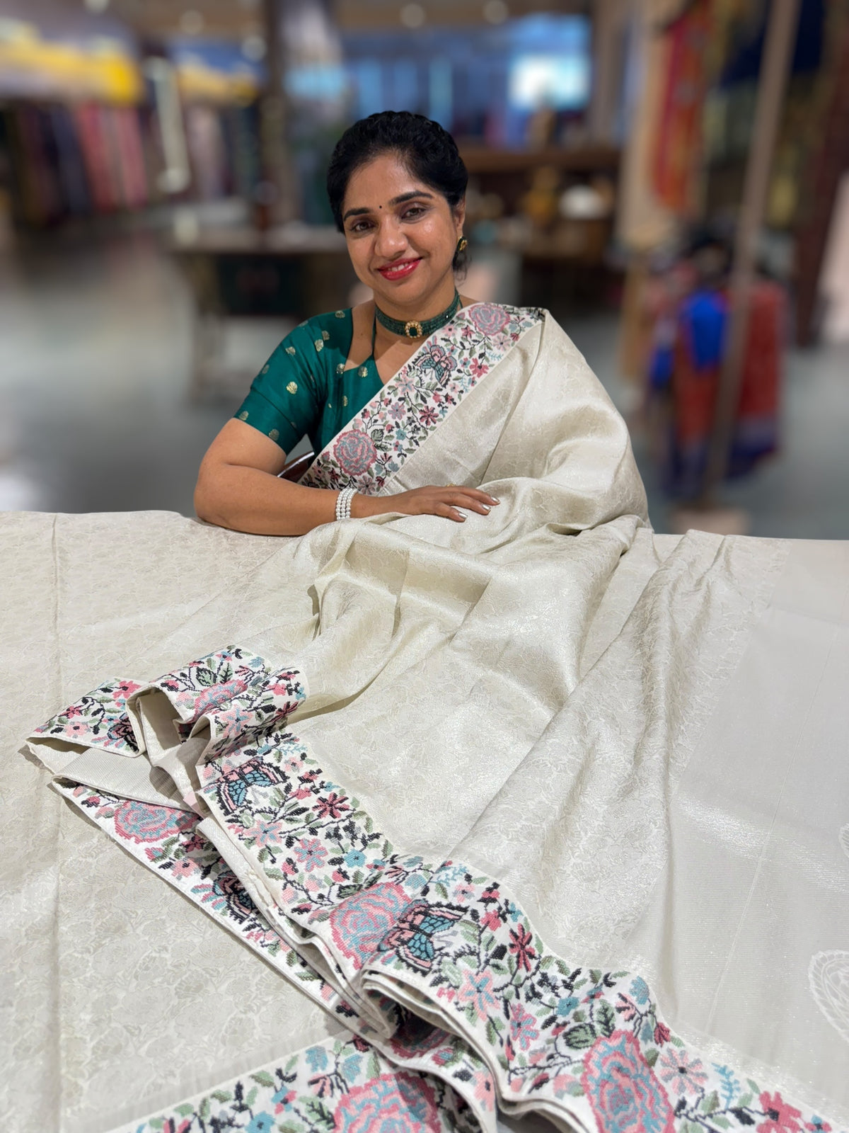 Half White Banarasi brocade Silk Saree with Petite Point Embroidered Border.