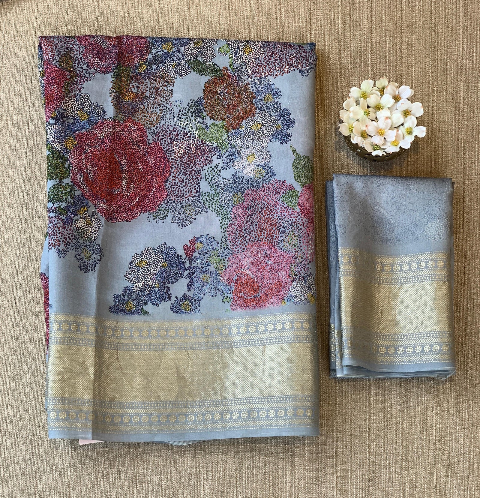 Dusty Blue Pure Handloom Chiniya Silk Saree with stunning Floral Print and zari borders