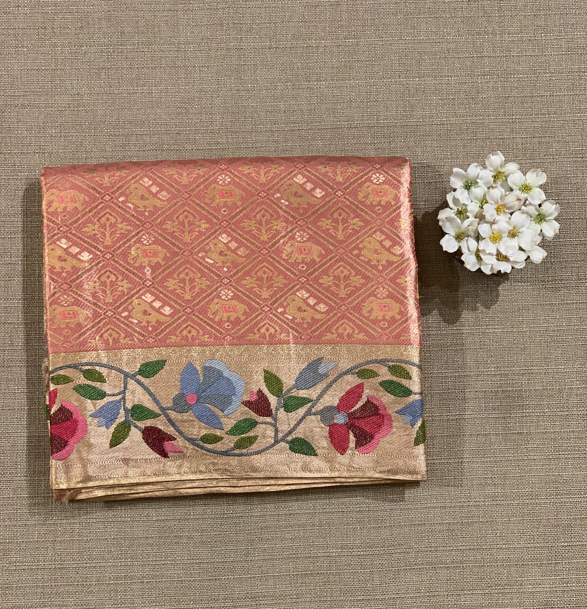 Coral Peach Kanchi Tissue Brocade Saree With jamdani inspired embroidery.