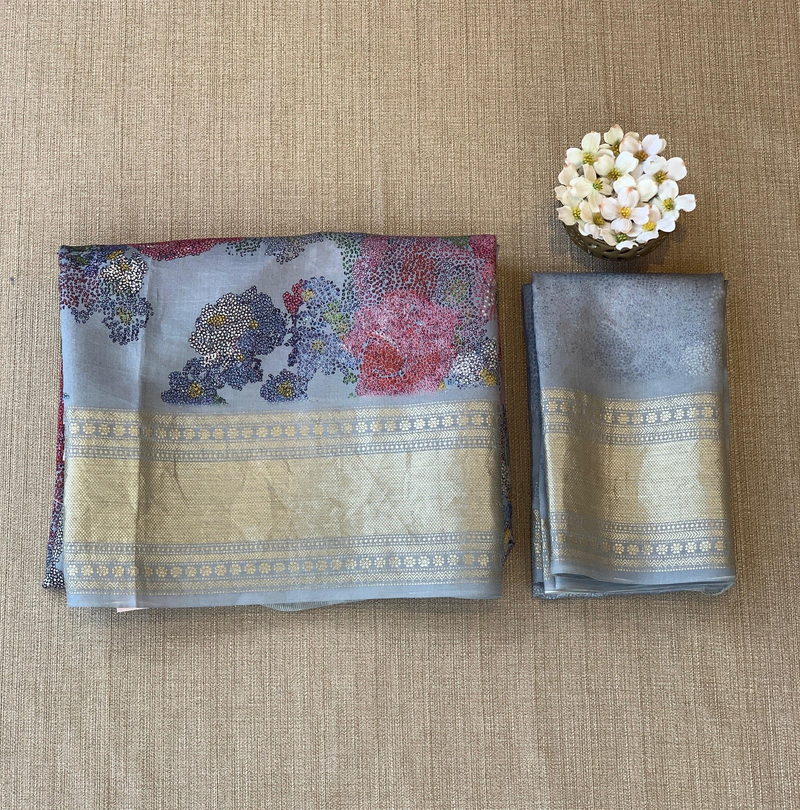 Dusty Blue Pure Handloom Chiniya Silk Saree with stunning Floral Print and zari borders