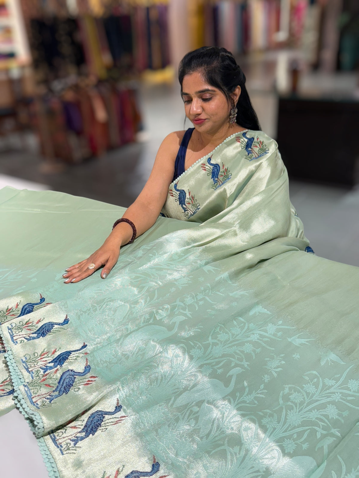 Mint Blue Banarasi Brocade tissue saree with tonchui style weaving & petite point embroidered swan border