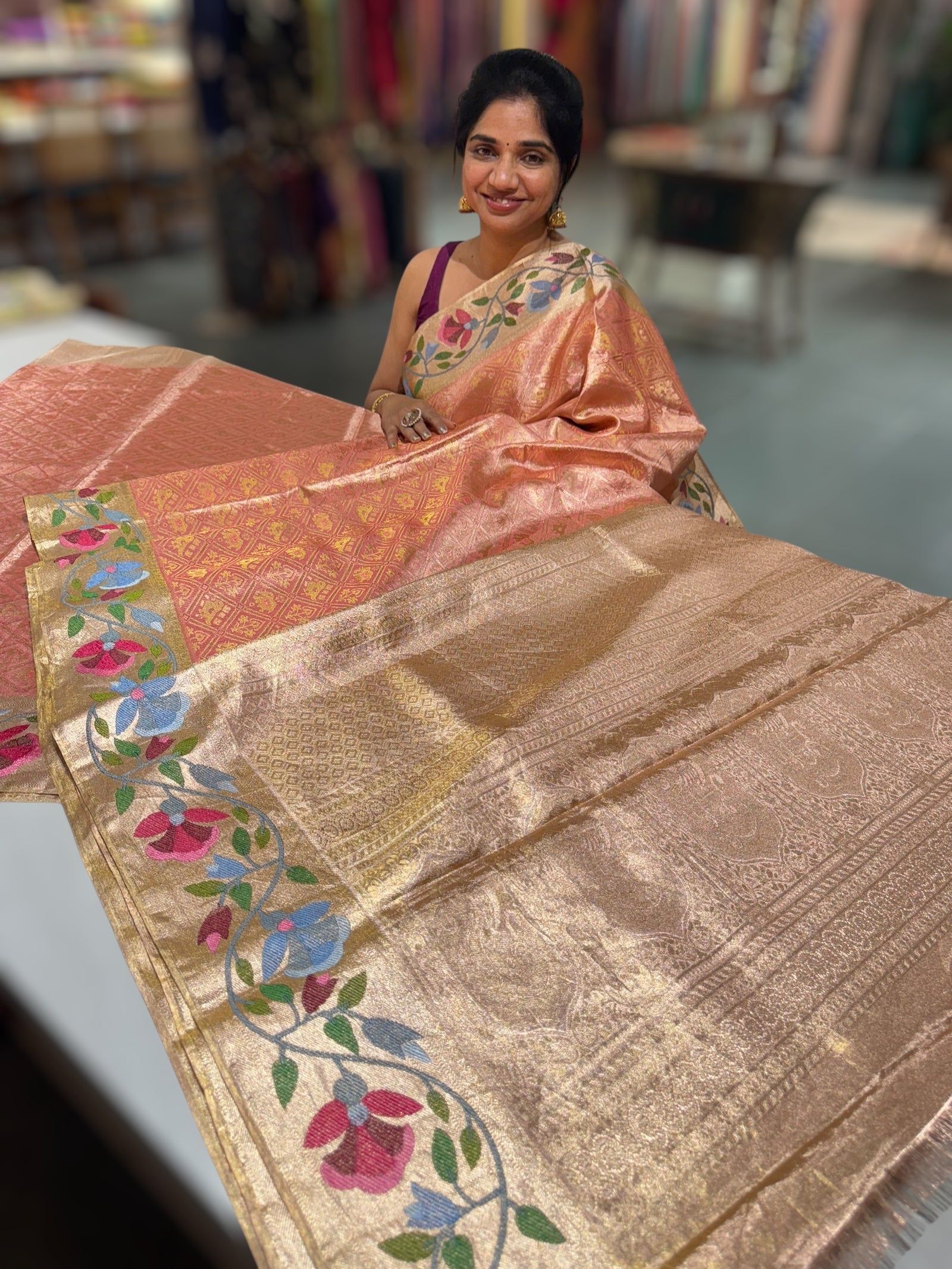Coral Peach Kanchi Tissue Brocade Saree With jamdani inspired embroidery.