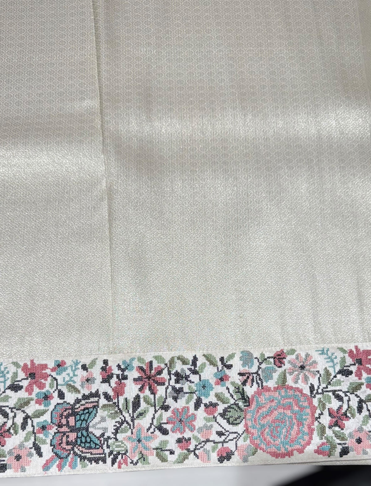 Half White Banarasi brocade Silk Saree with Petite Point Embroidered Border.