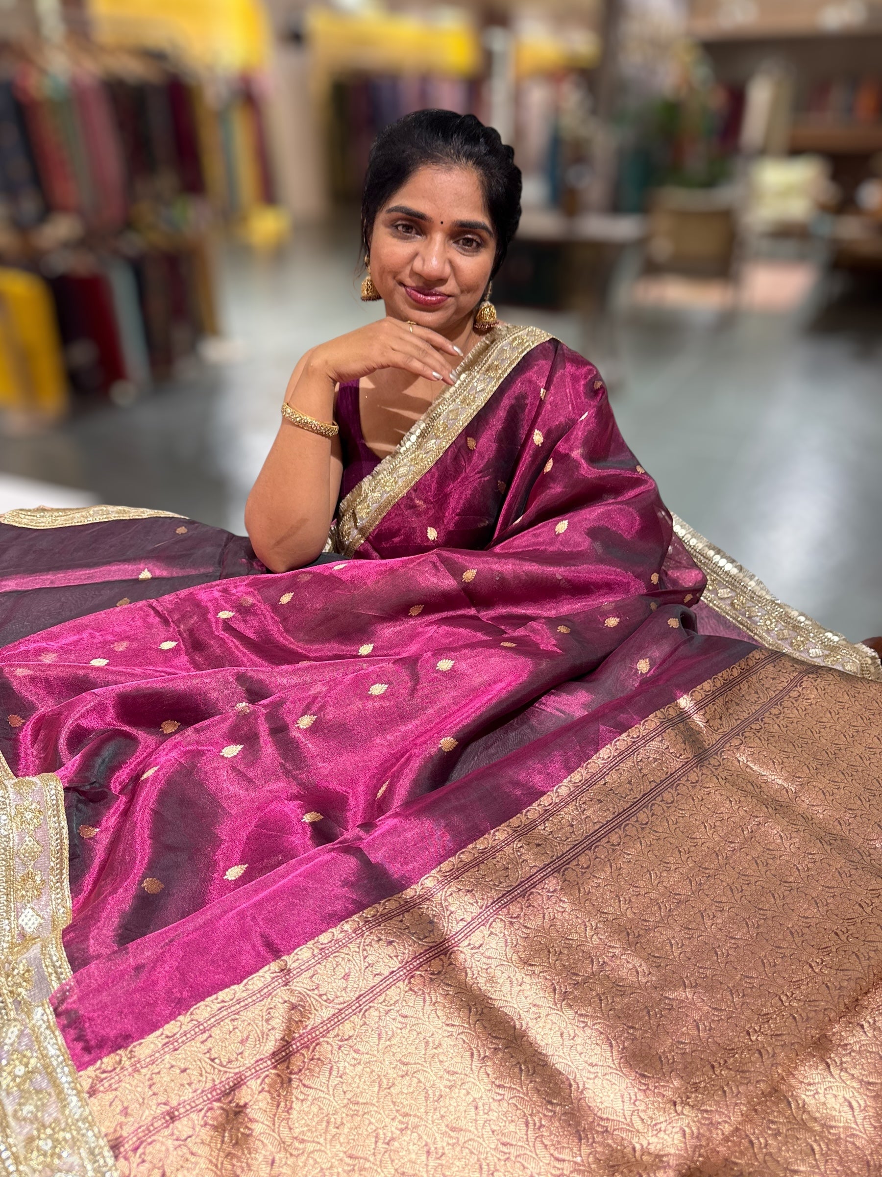 Wine Pure handloom Banarasi Tissue saree hemlined with Sabhyasachi style fringe laces .