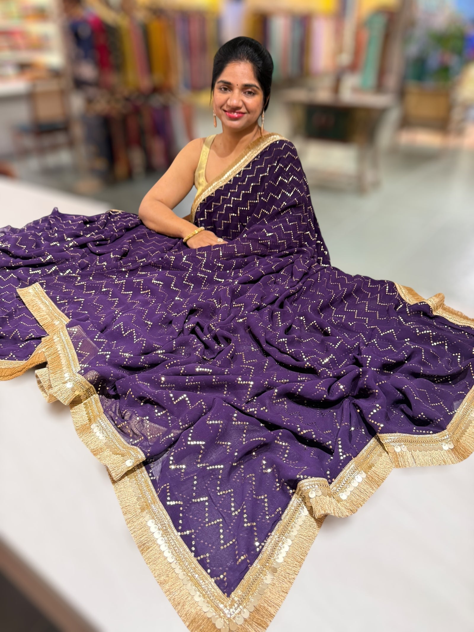 Dark Violet Georgette Saree with stick on Badla in zigzag pattern
