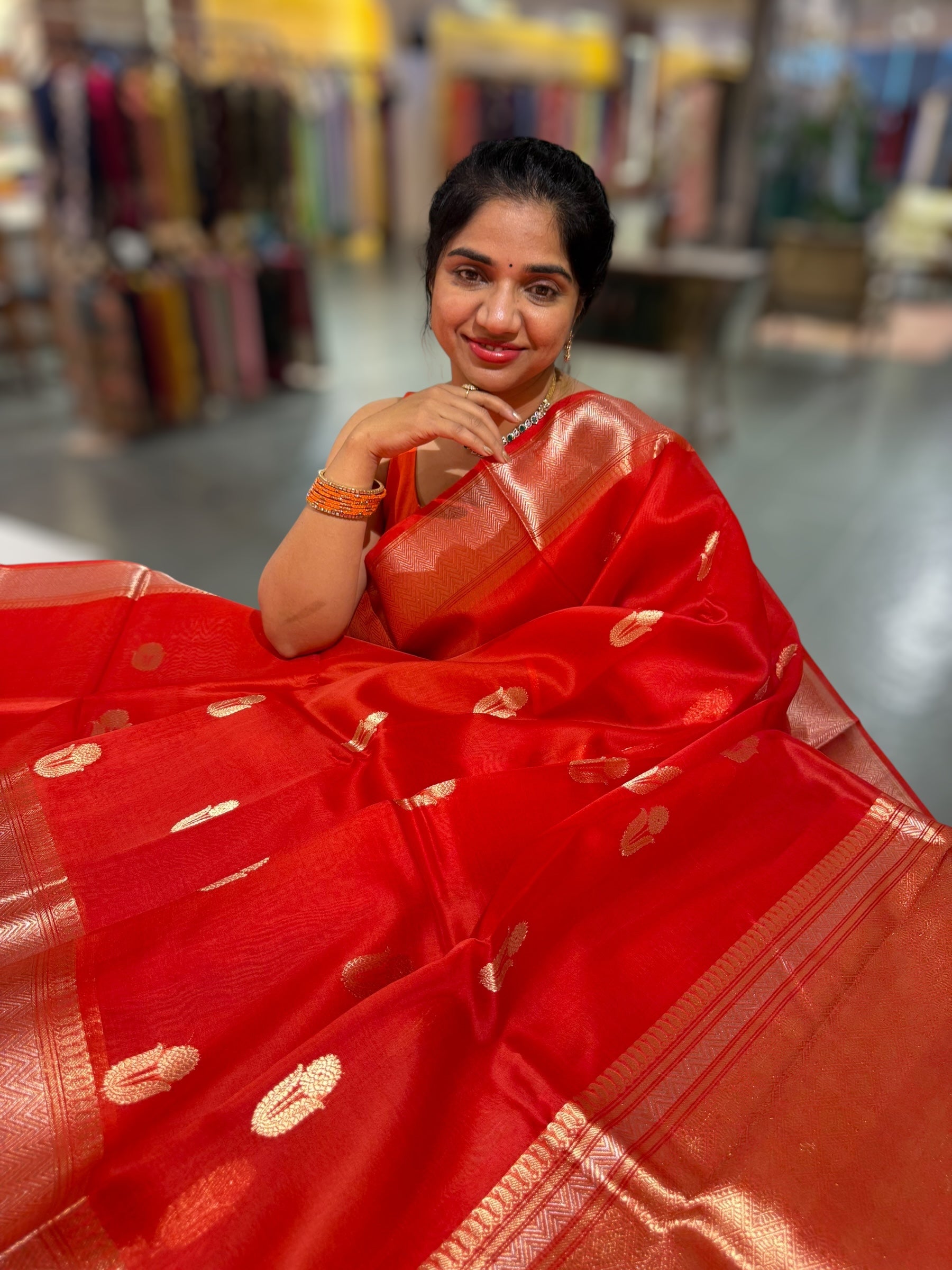 Orangish Red Premium Kora Banarasi Saree with heavy weaving borders and Raw mango style motifs