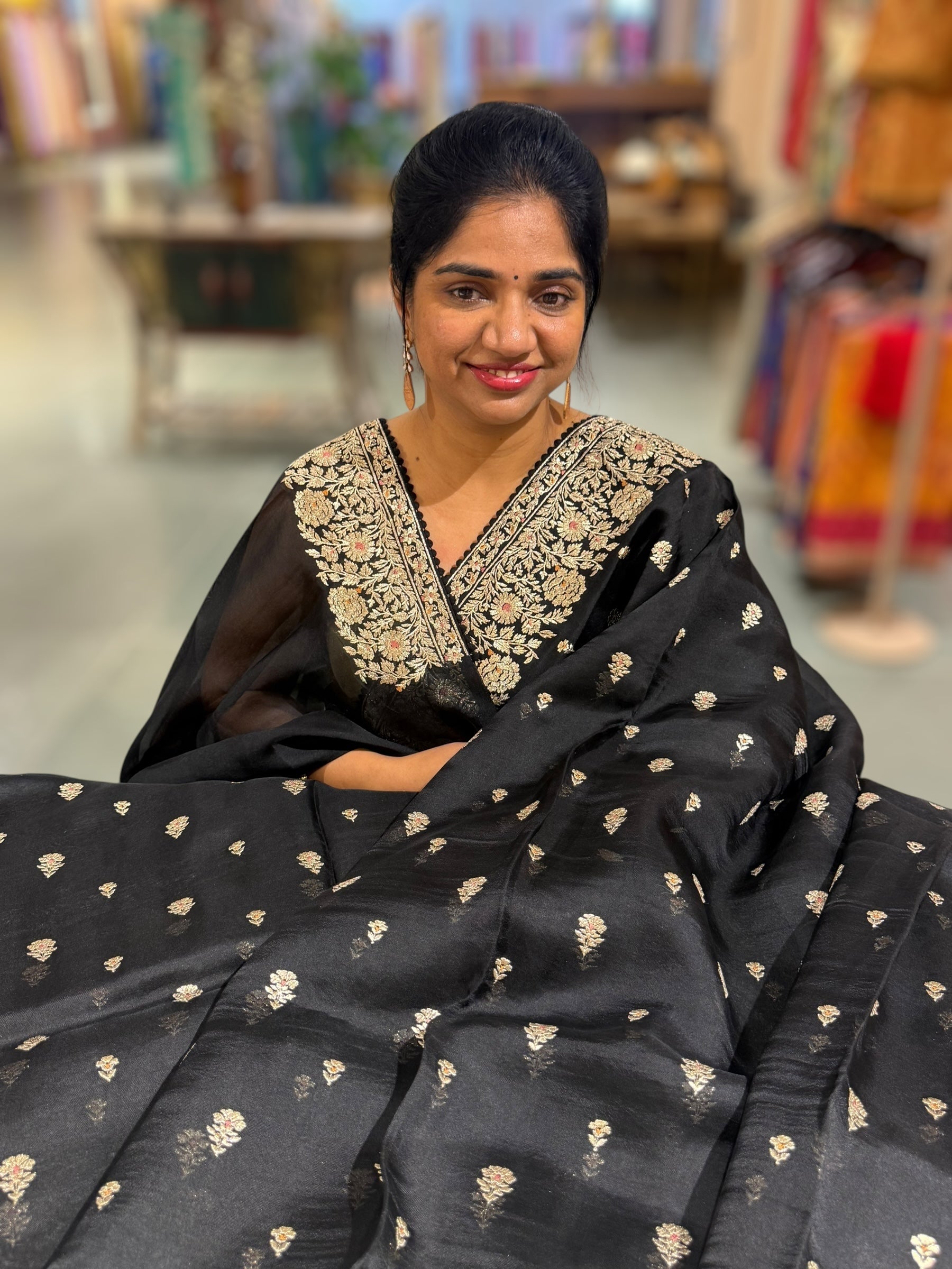 Black Organza Saree with stunning heavy zari embroidered border and alloevr motifs