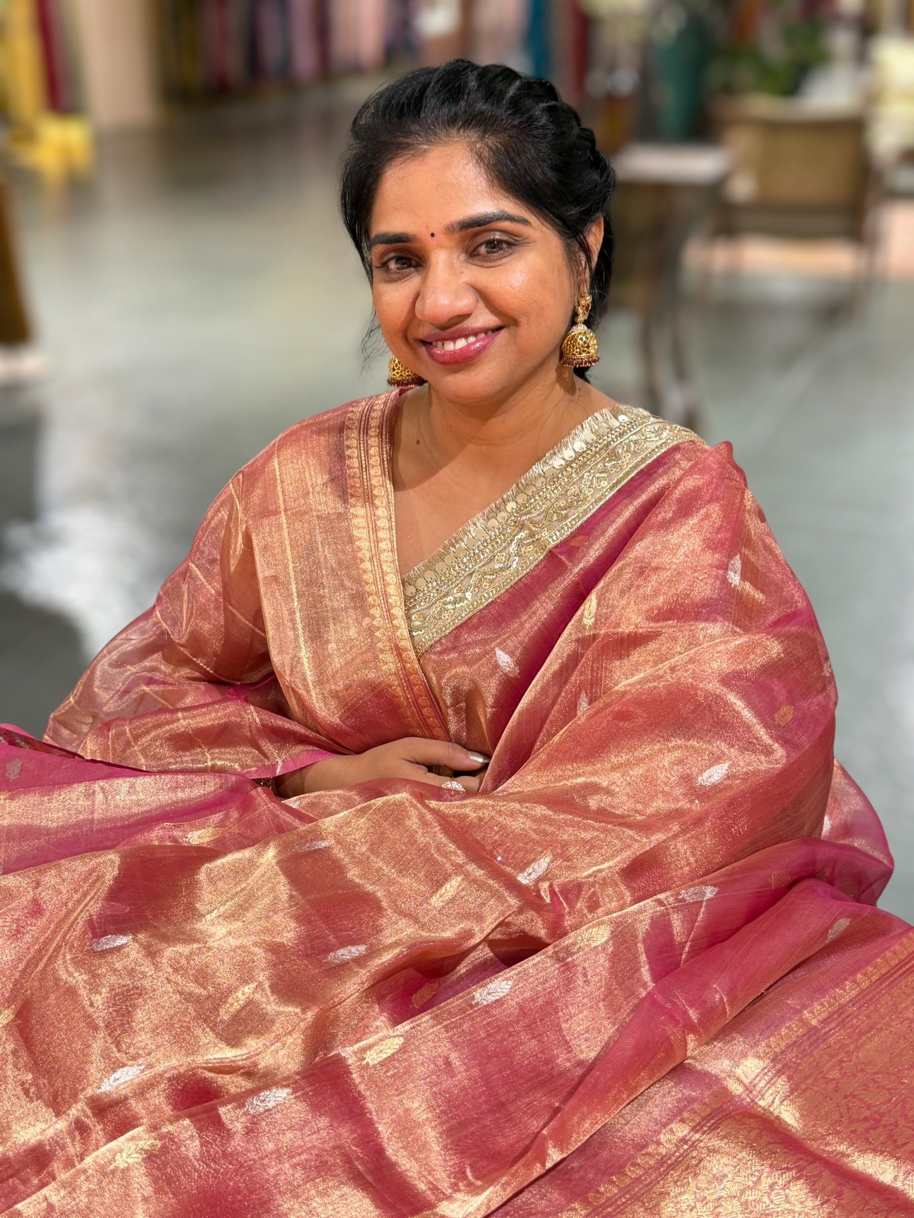 Pink Pure handloom Banarasi Tissue saree hemlined with Sabhyasachi style fringe laces .