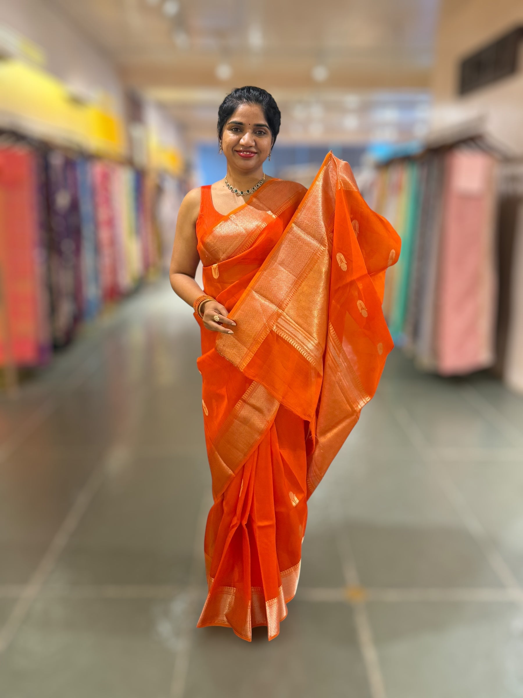 Orange Premium Kora Banarasi Saree with heavy weaving borders and Raw mango style motifs