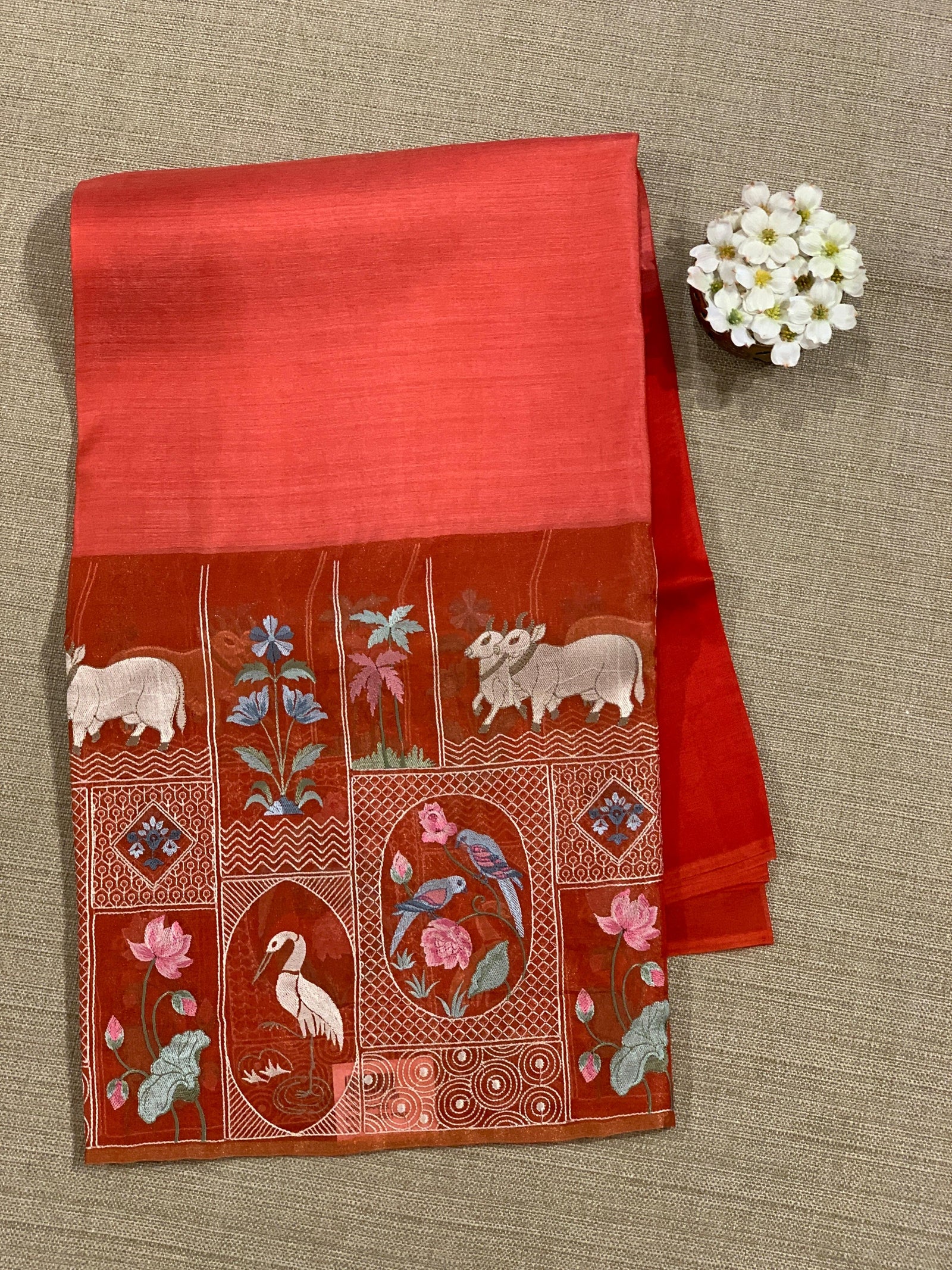 Reddish Orange Kora-Tussar blend Handloom Saree with Tissue embroidered Skirt Border