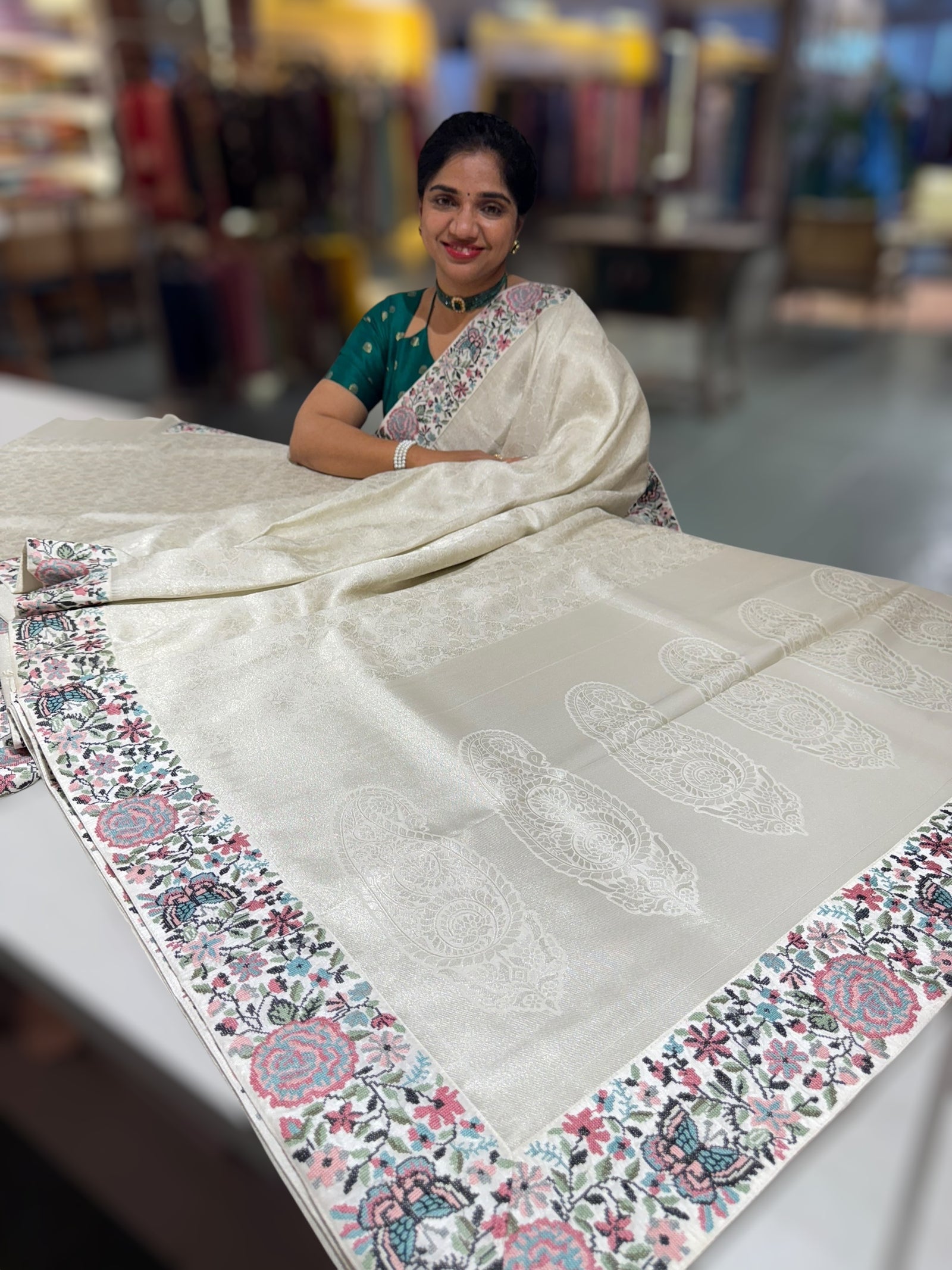 Half White Banarasi brocade Silk Saree with Petite Point Embroidered Border.