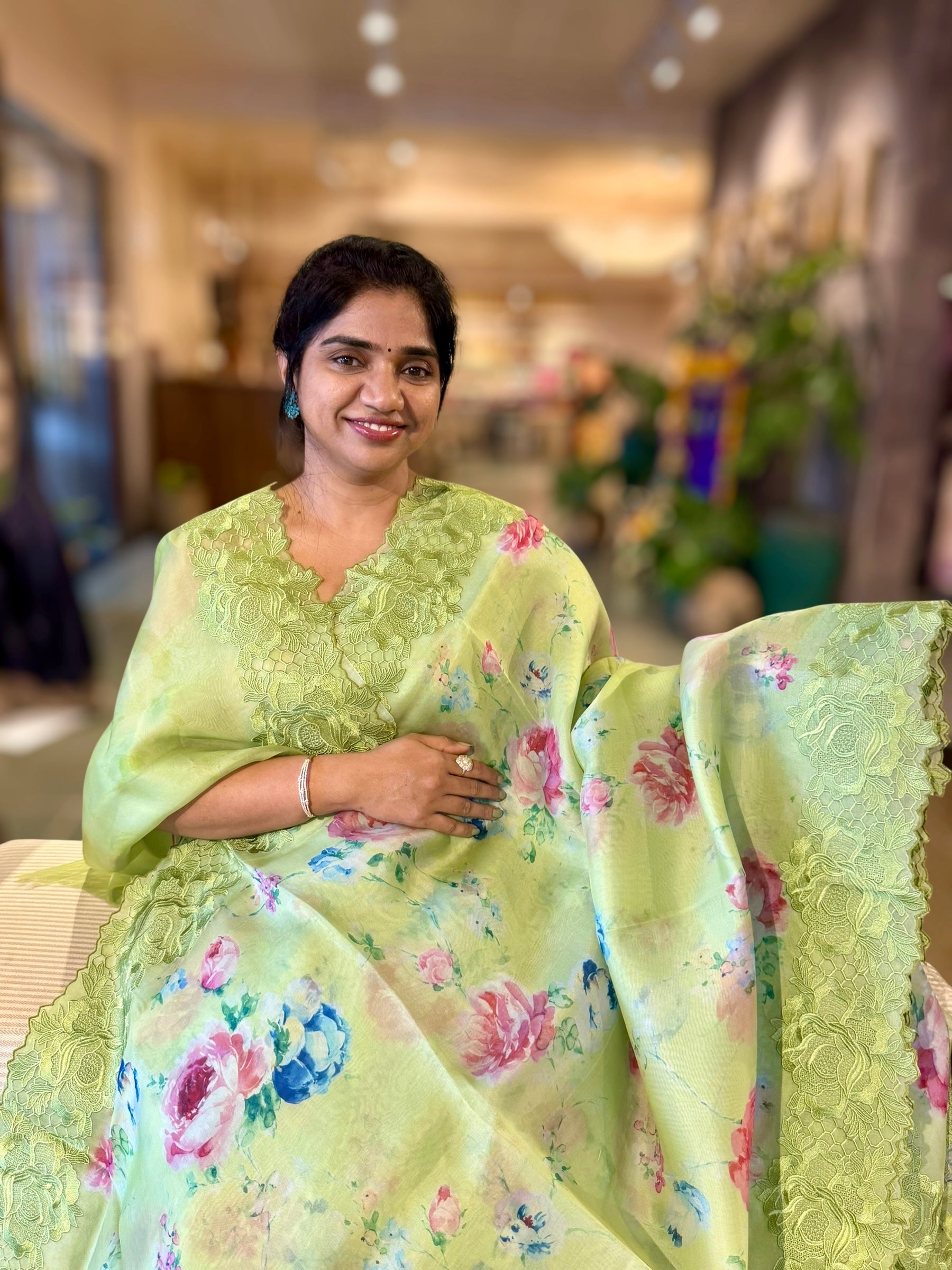 Parrot Green Printed Organza Saree With Chantilly Lace Style Embroidered Border.