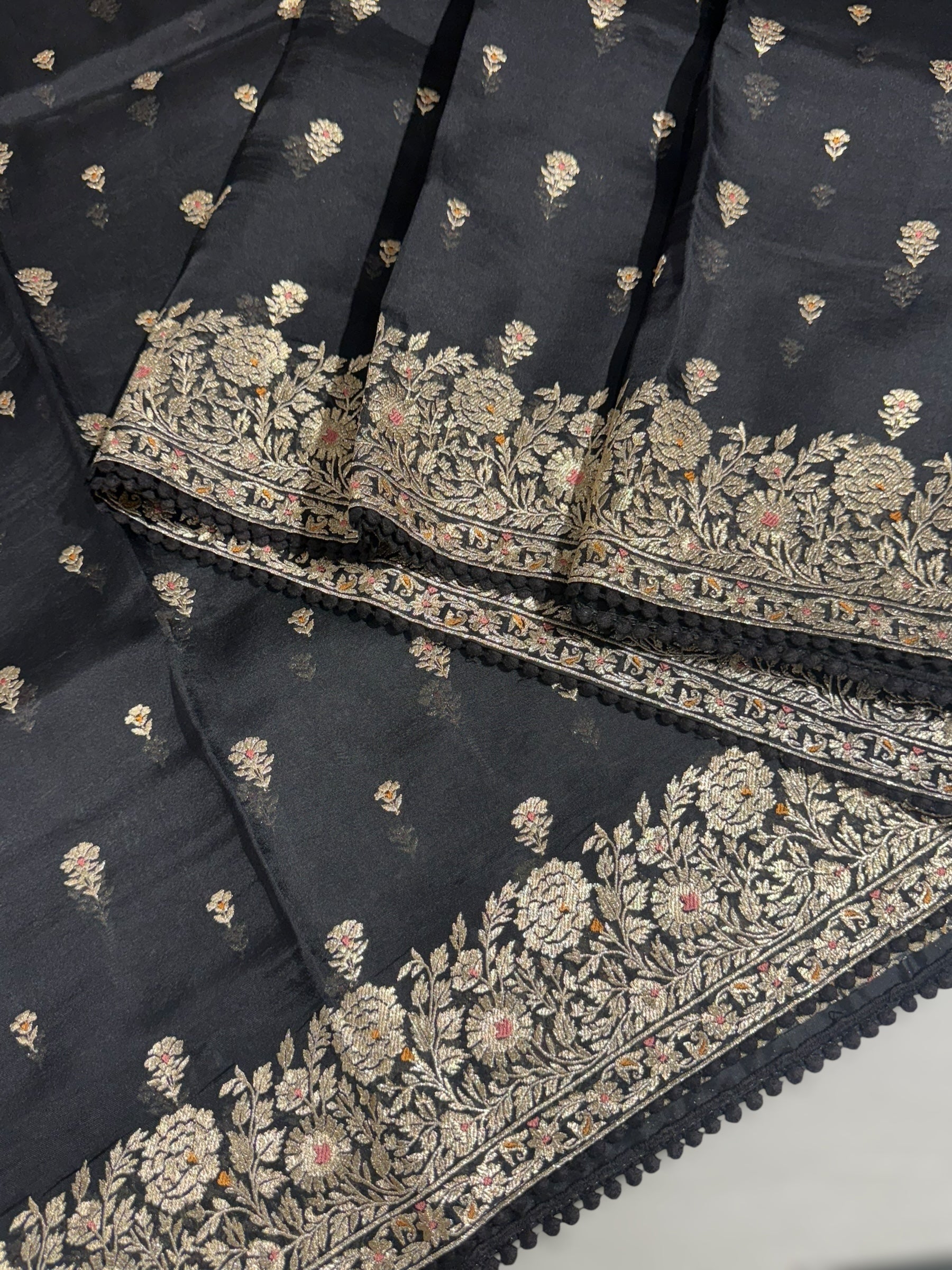 Black Organza Saree with stunning heavy zari embroidered border and alloevr motifs