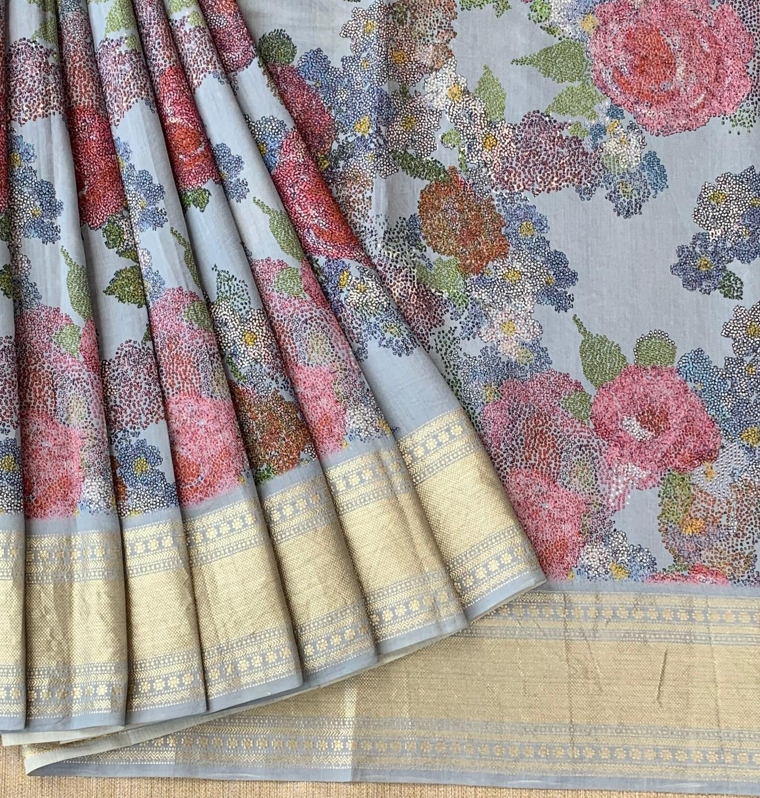 Dusty Blue Pure Handloom Chiniya Silk Saree with stunning Floral Print and zari borders