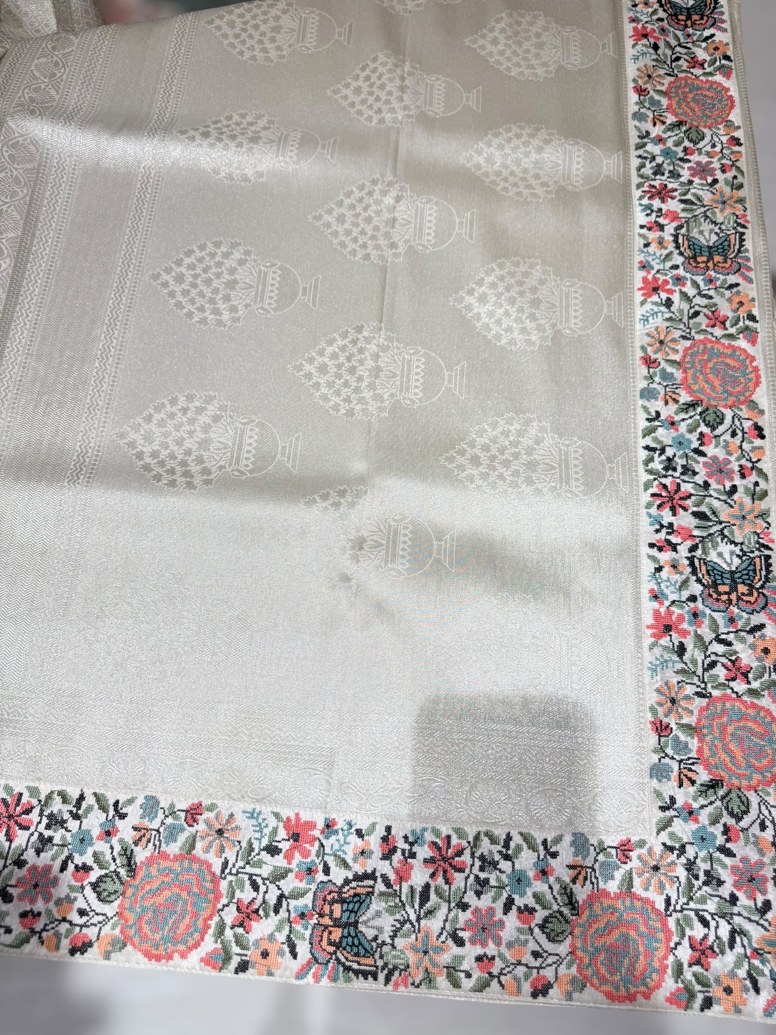 Half White Banarasi  brocade Silk Saree with Petite Point Embroidered Border.