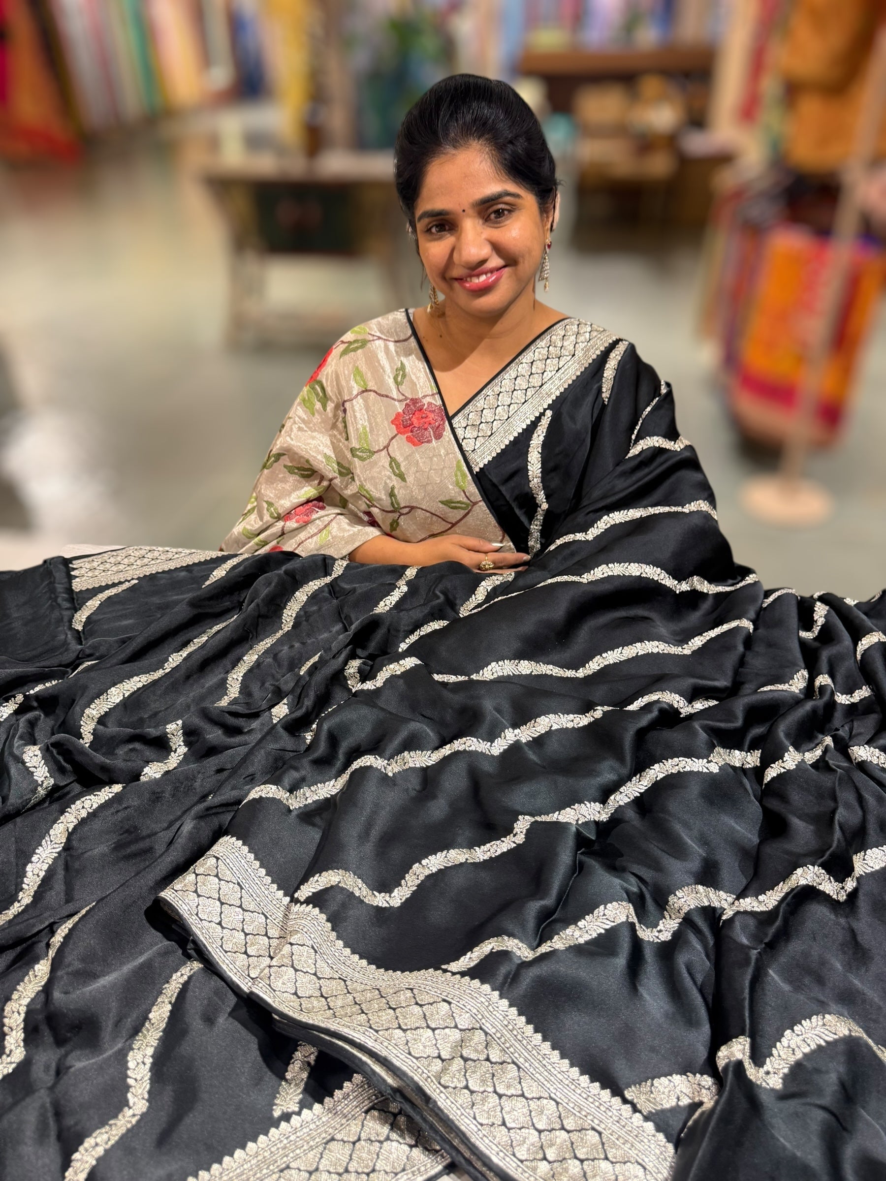 Black Designer Satin Saree with stunning embroidery paired with Silver tissue Pythani embroidered blouse